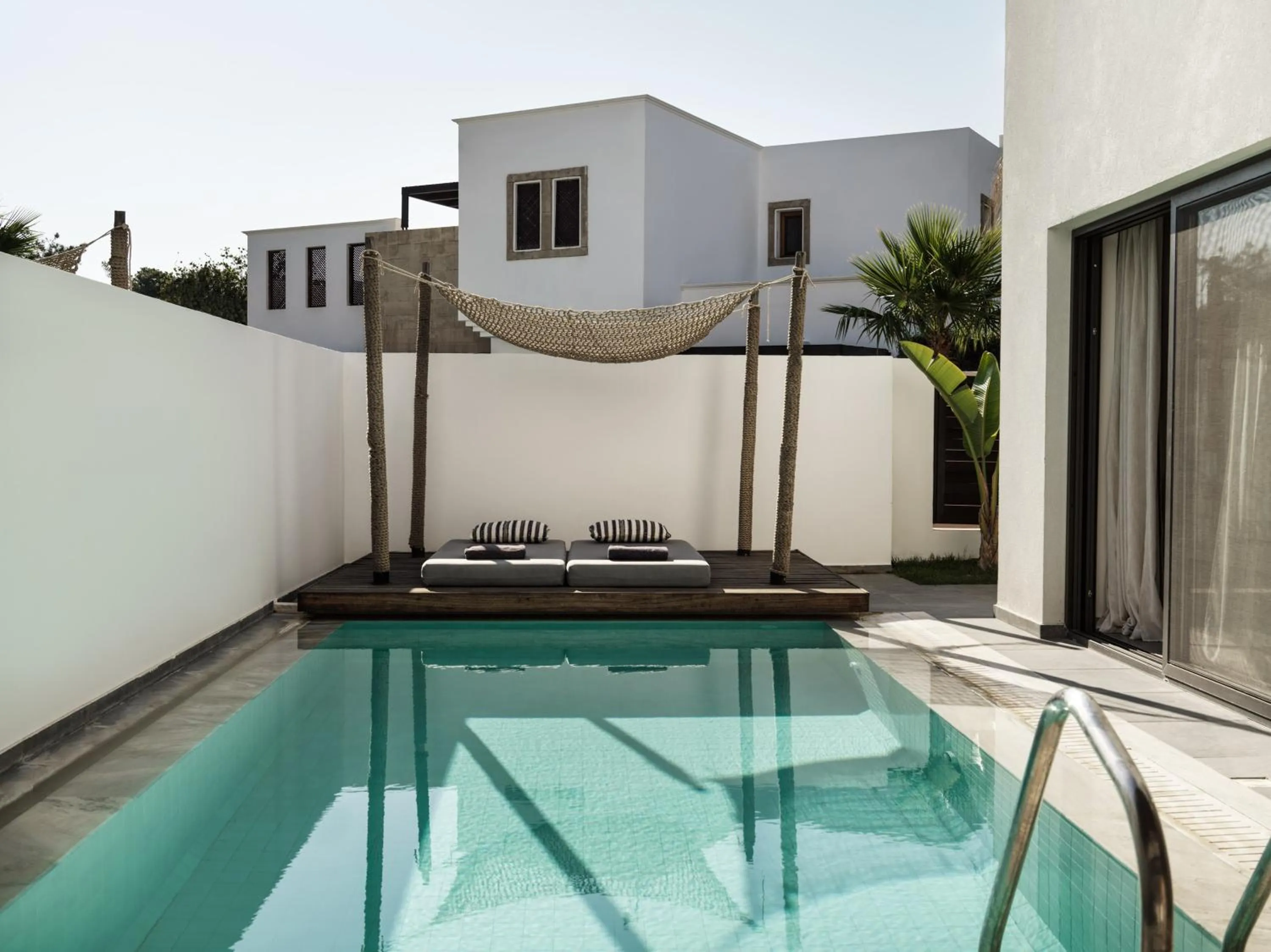 Pool view in Lindian Village, Curio Collection by Hilton