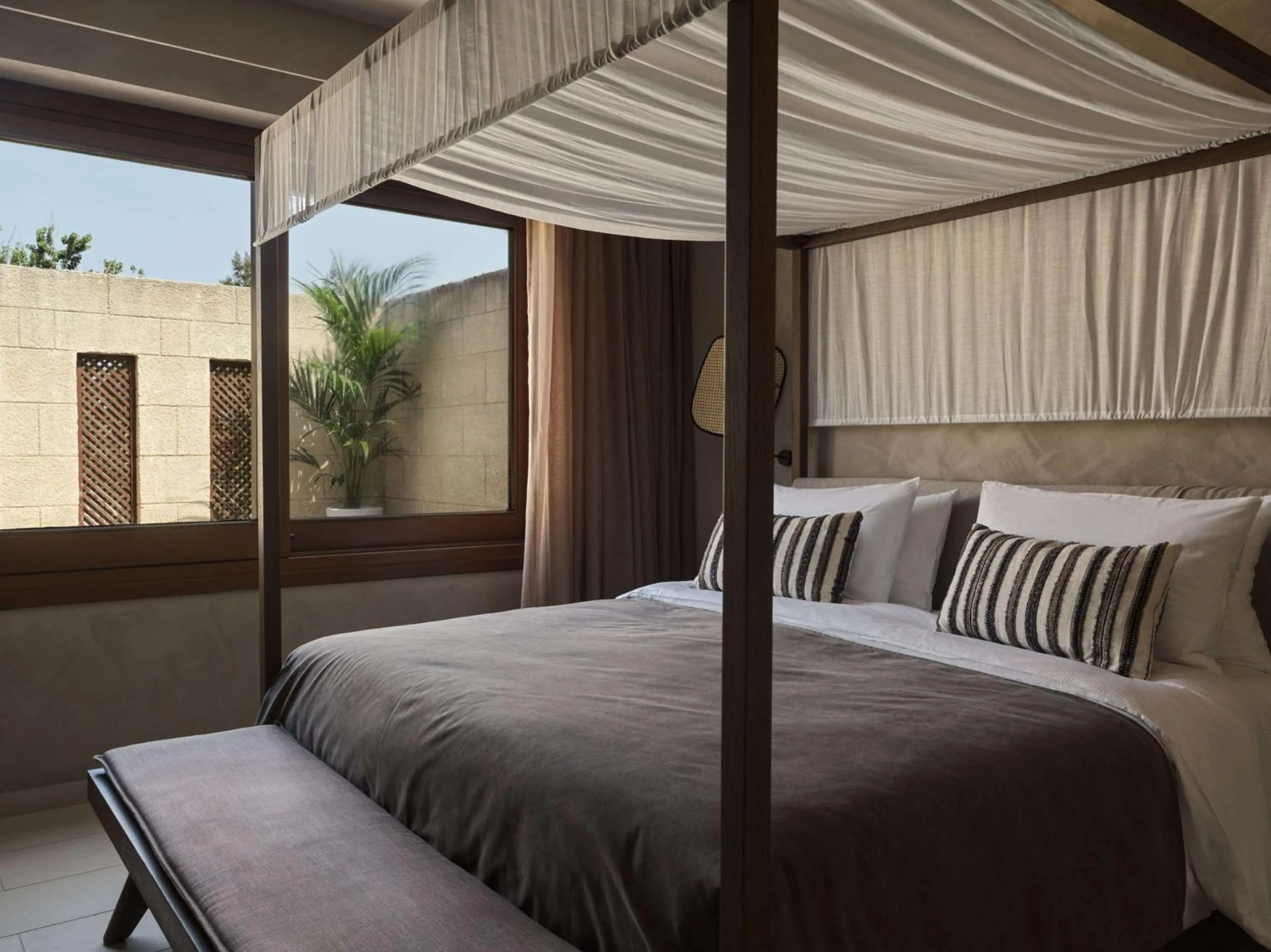 Bed in Lindian Village, Curio Collection by Hilton