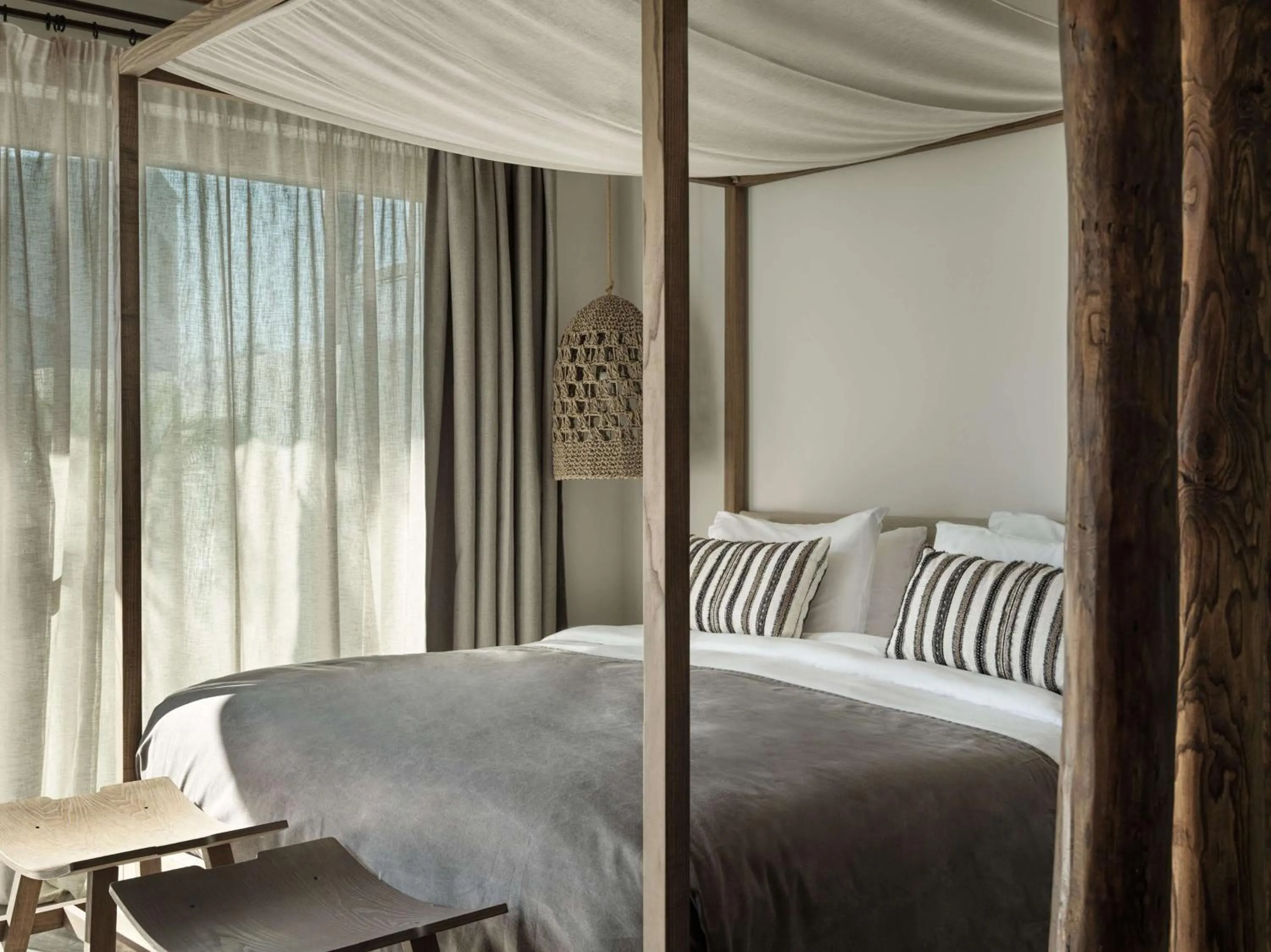 Bed in Lindian Village, Curio Collection by Hilton