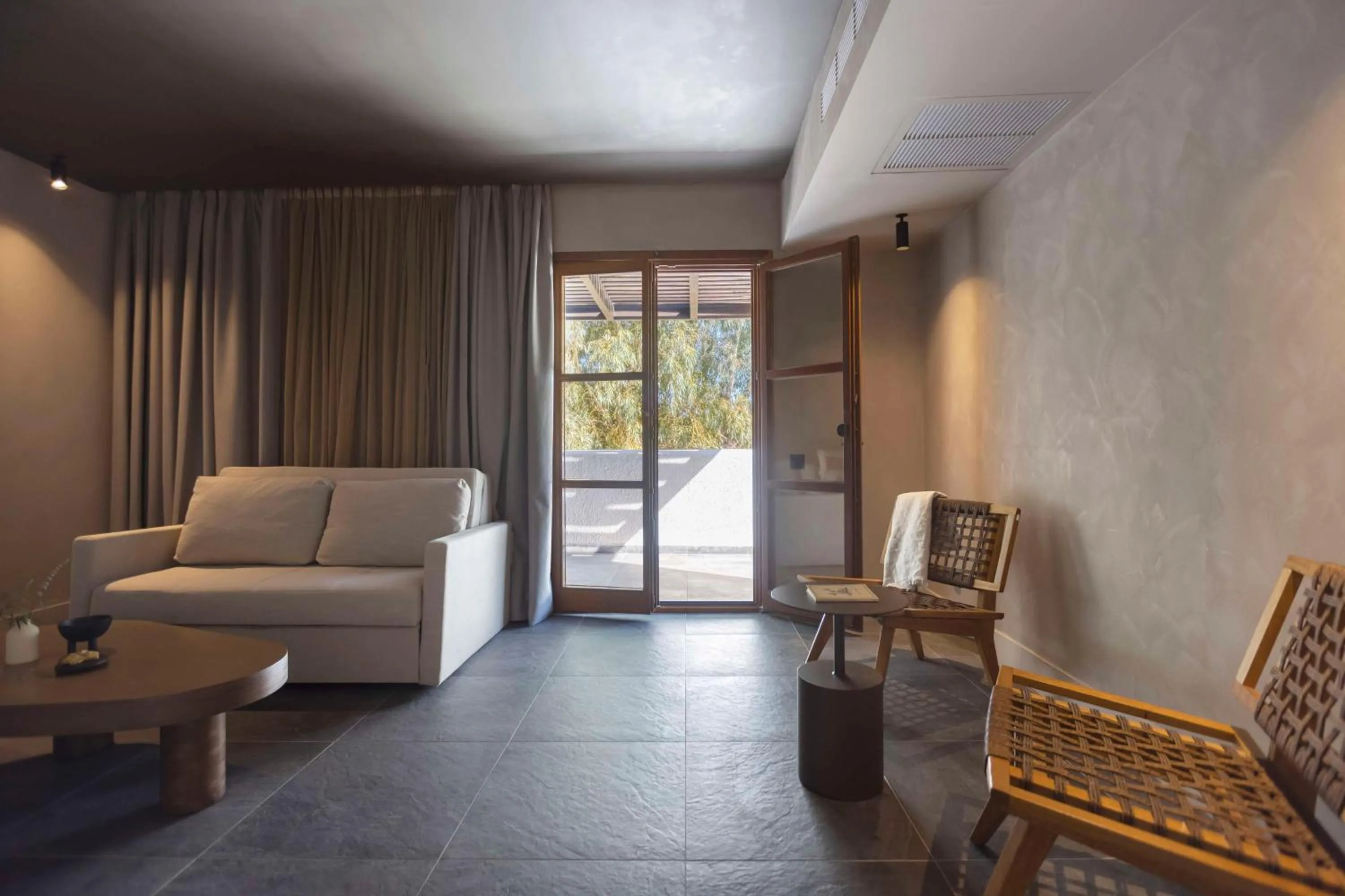 Living room in Lindian Village, Curio Collection by Hilton