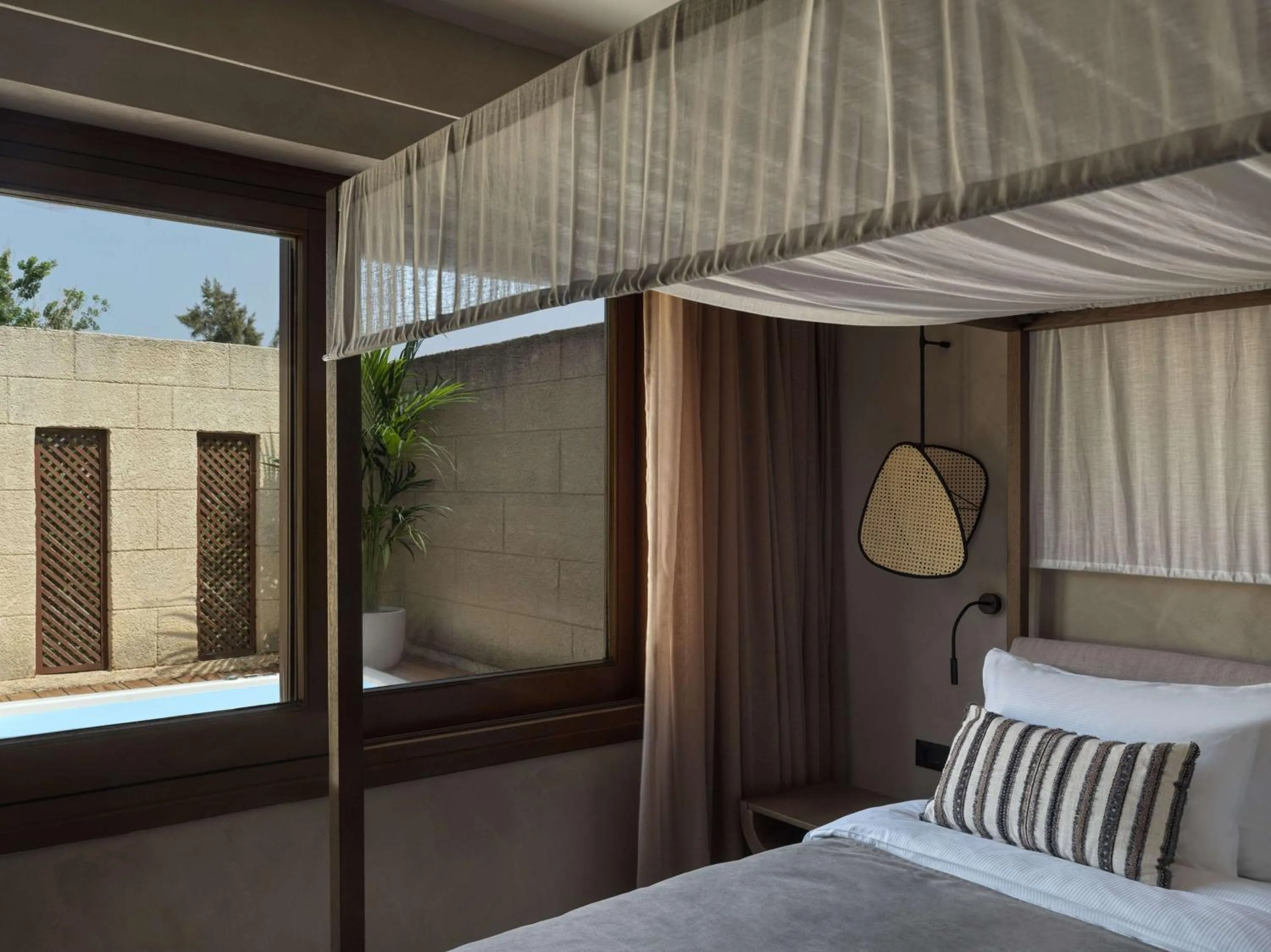 Bed in Lindian Village, Curio Collection by Hilton