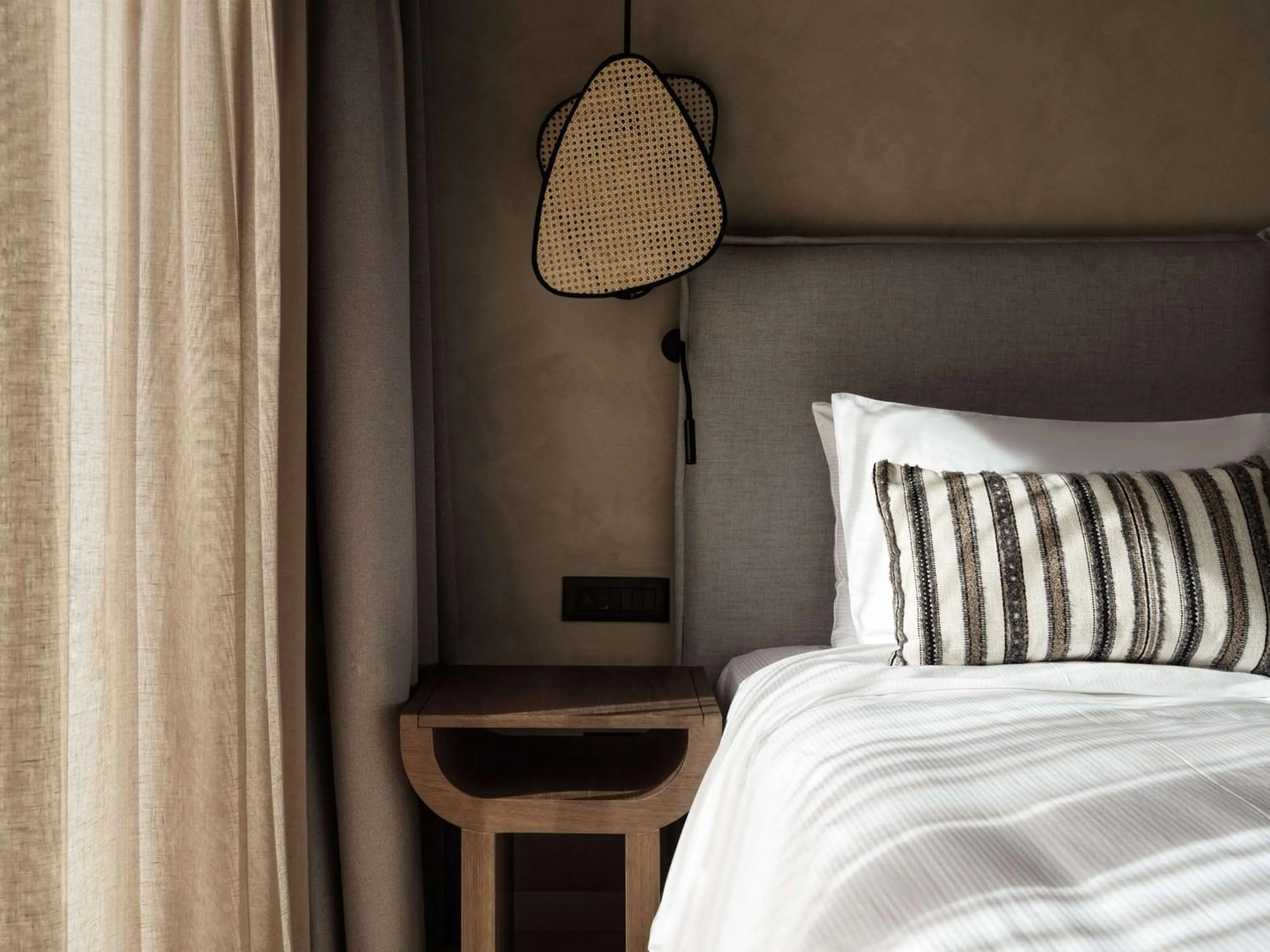 Bed in Lindian Village, Curio Collection by Hilton