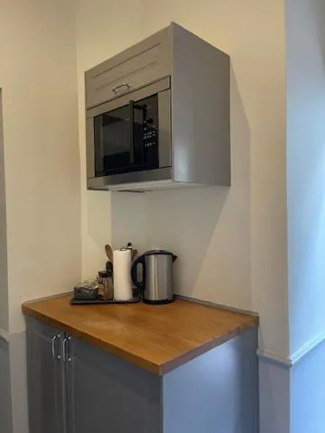 Kitchen or kitchenette in Angel House Aparthotel