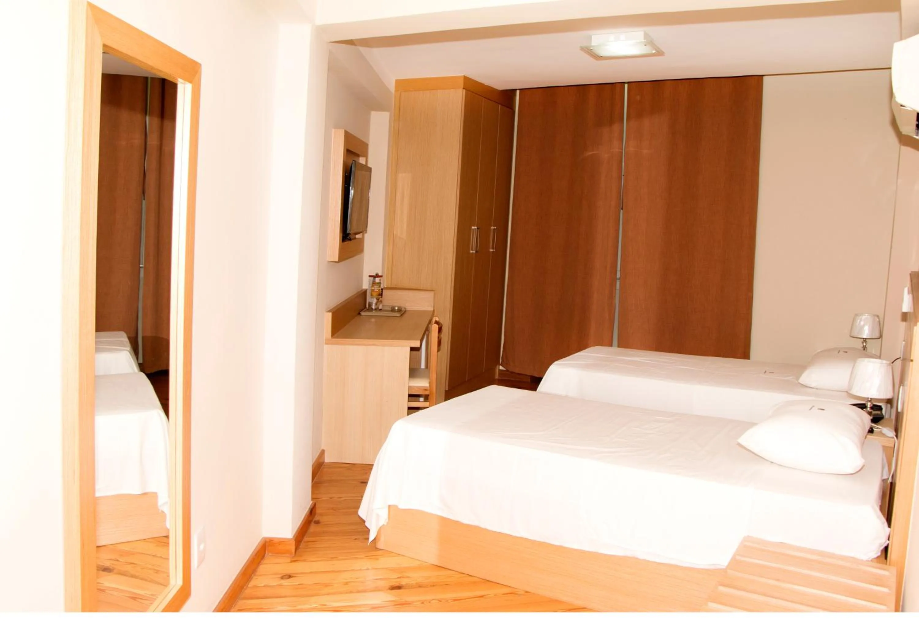 Bed in Hotel Pouso Real