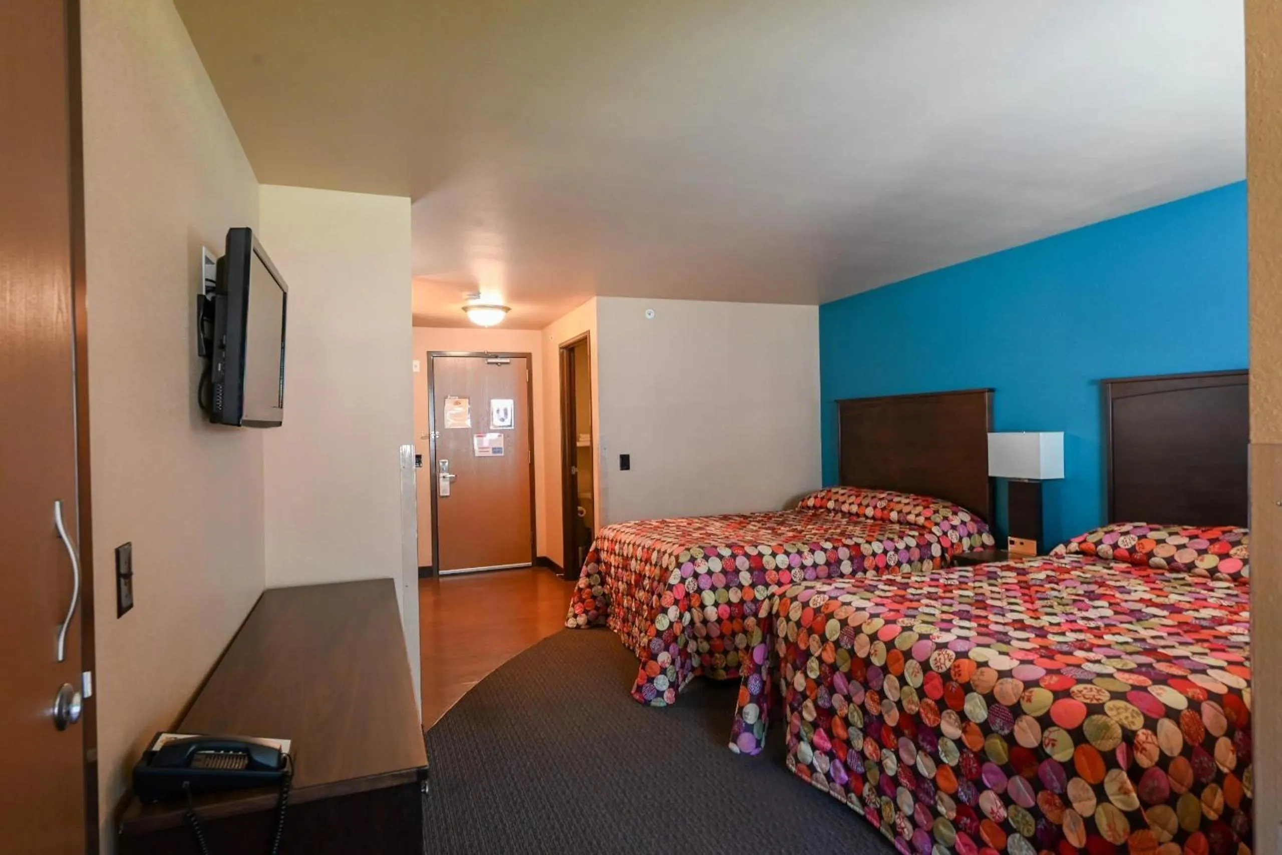 Bed in Sunset Bay Resort & Suites