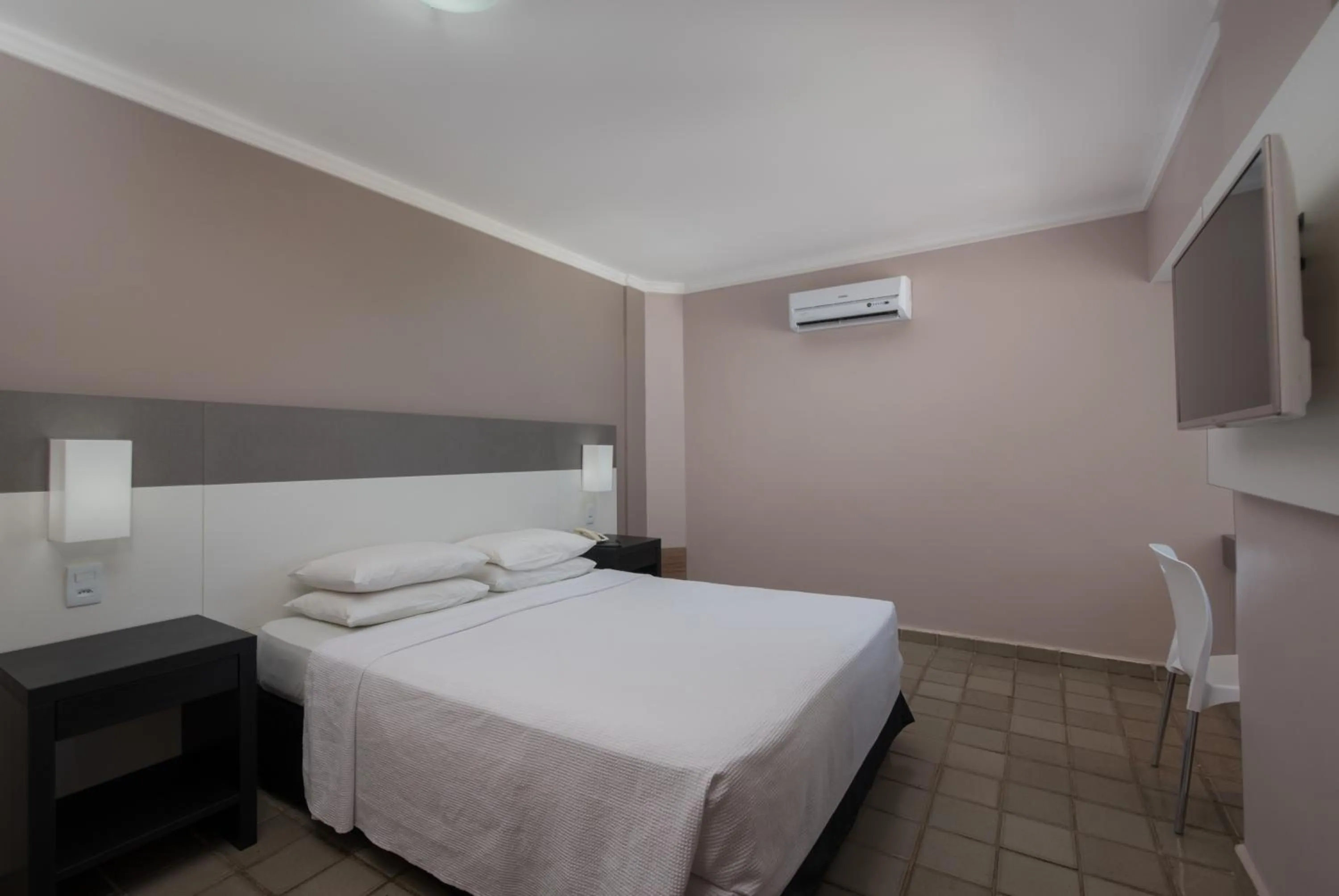 Bed in Hotel Sete Coqueiros