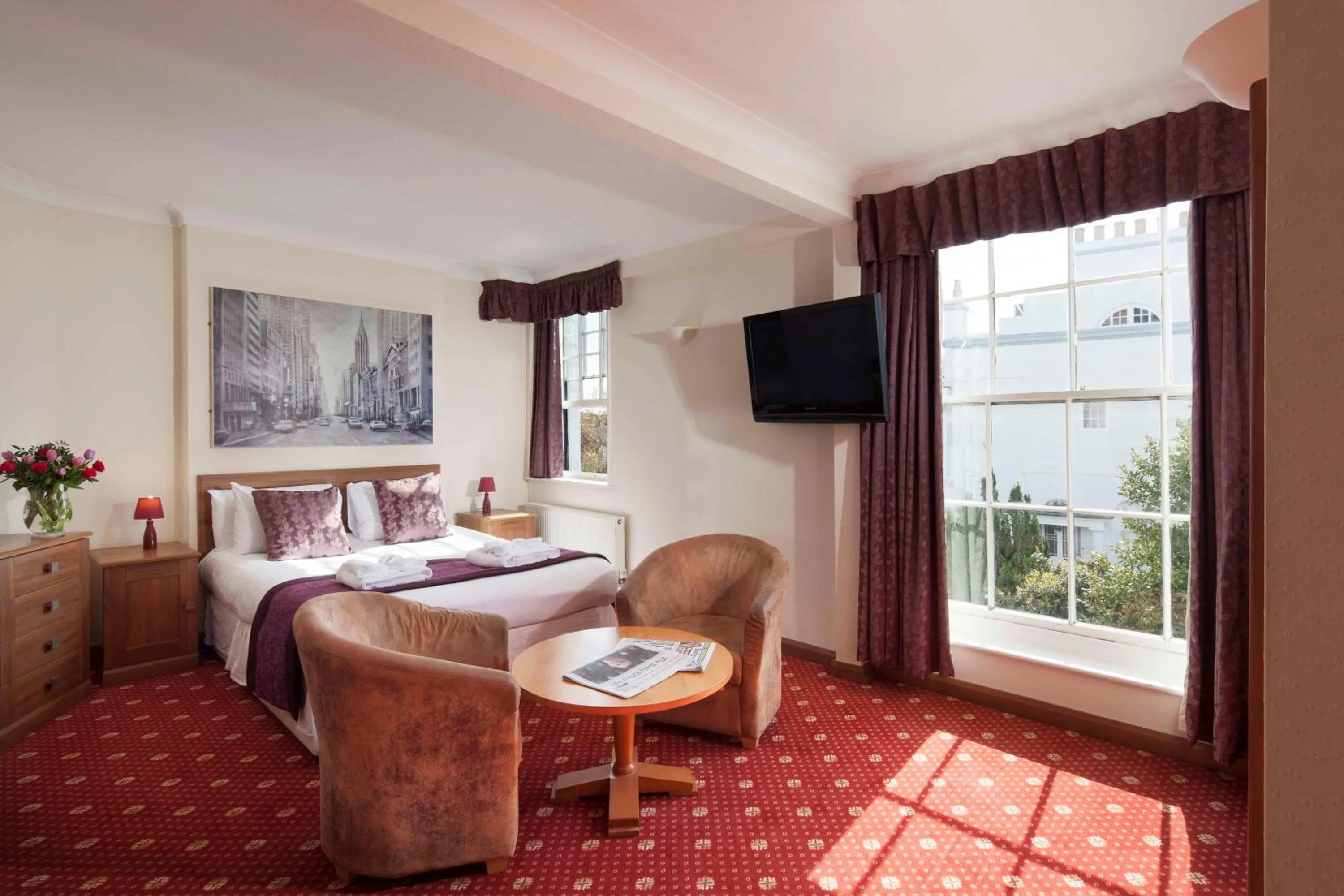 Bed in Royal Beacon Hotel