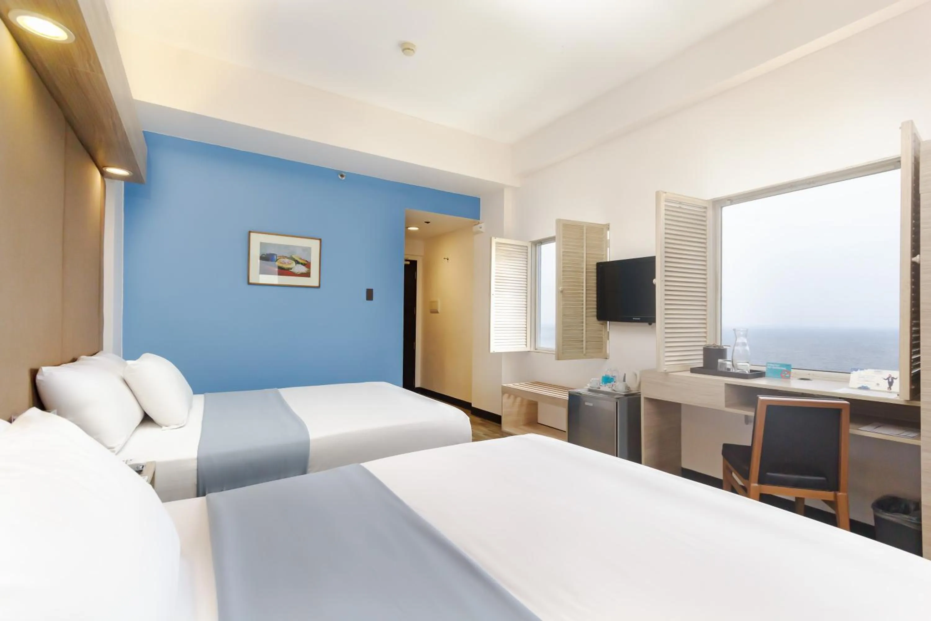 Photo of the whole room, Bed in Microtel by Wyndham Mall of Asia