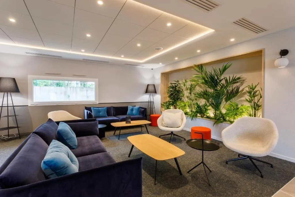 Living room in Brit Hotel Piscine & Spa - Fougères