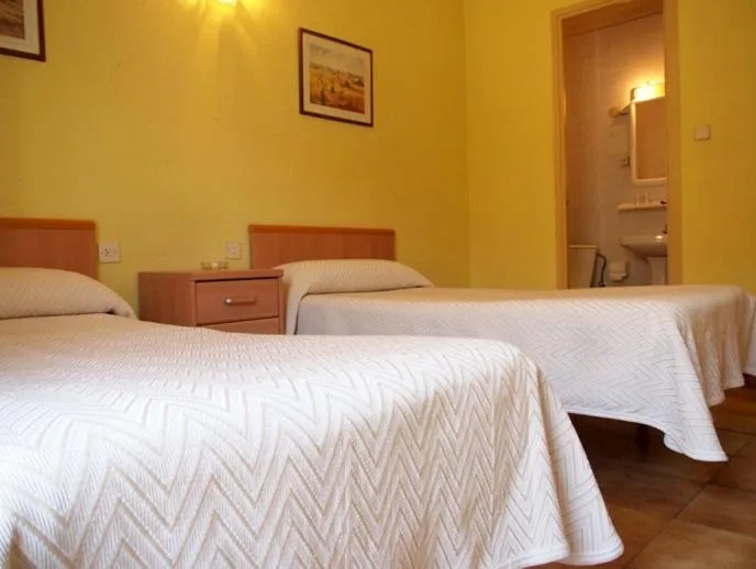 Photo of the whole room, Bed in Hostal Delfos