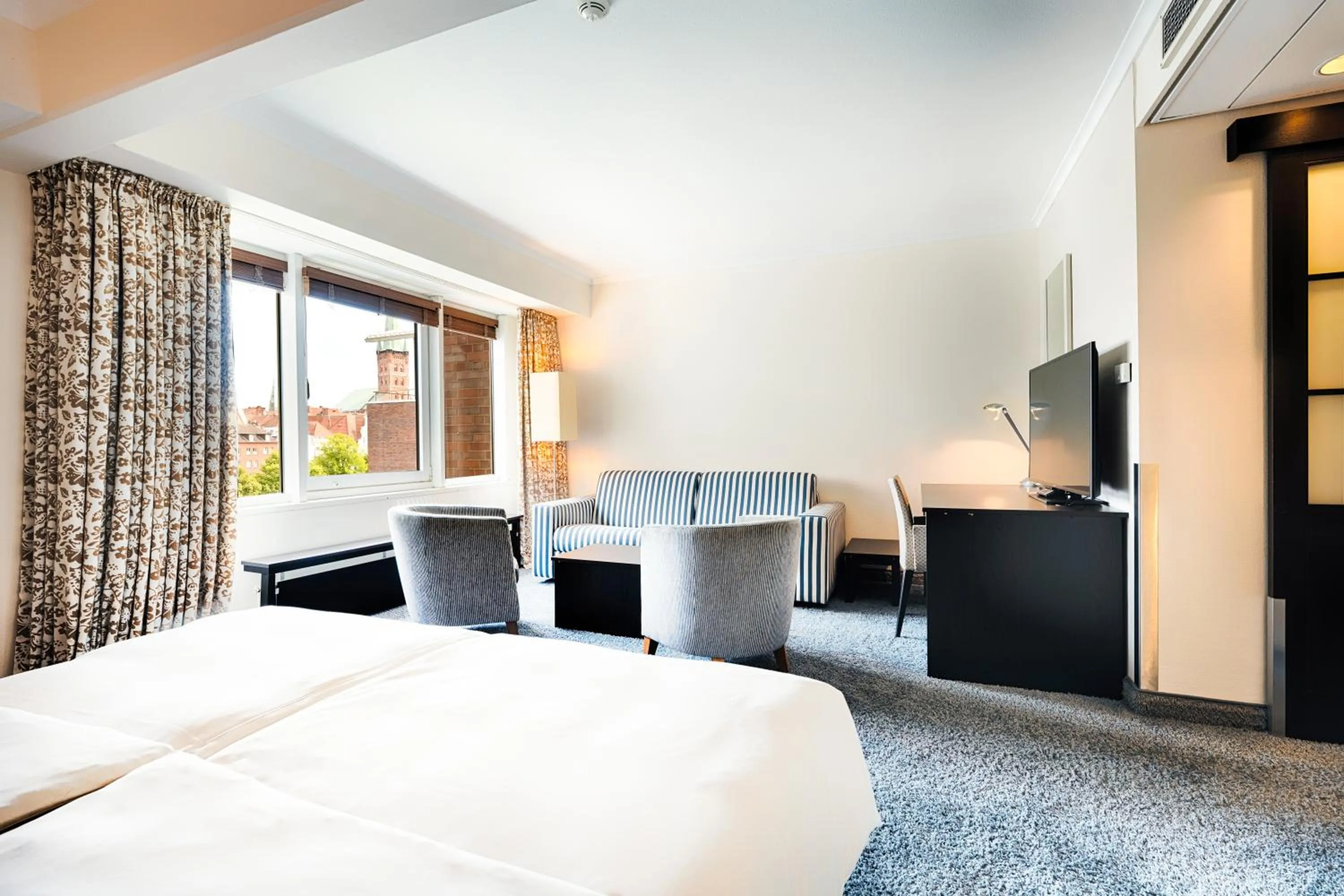 Seating area, Bed in Radisson Blu Senator Hotel, Lübeck