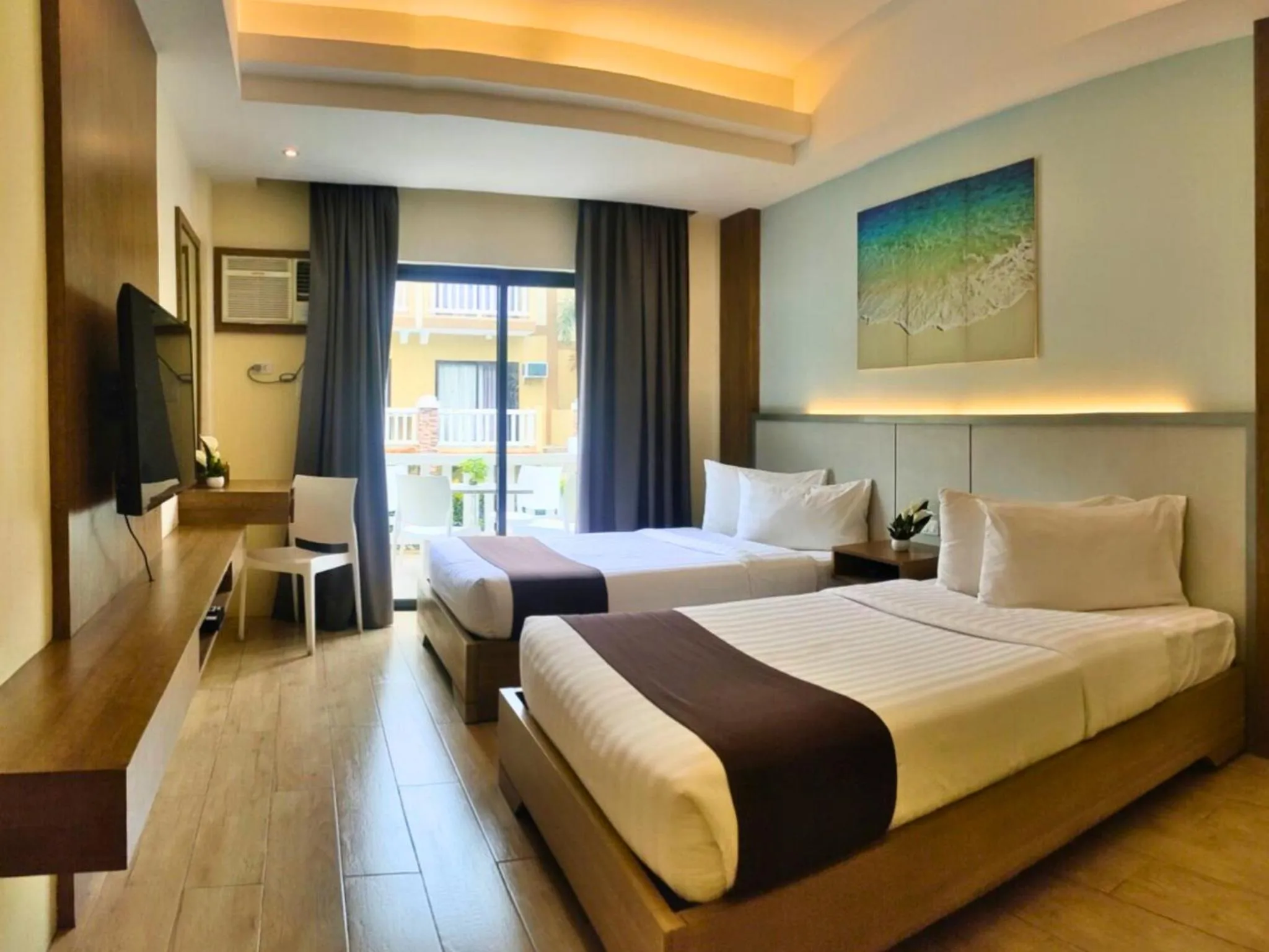 Bed in Aquamira Hotel & Resort