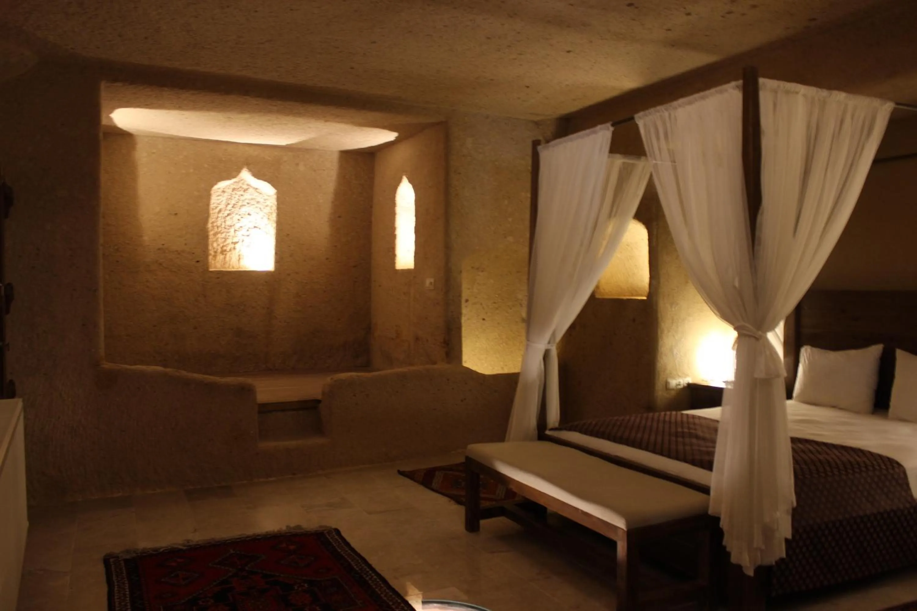 Bed in Helike Cave Suites