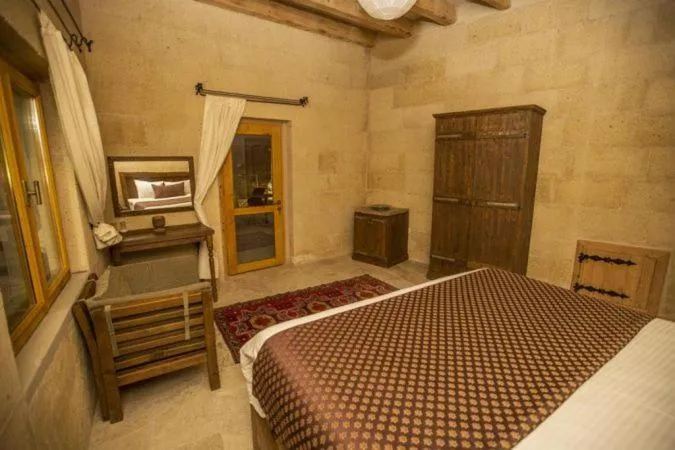 Bed in Helike Cave Suites
