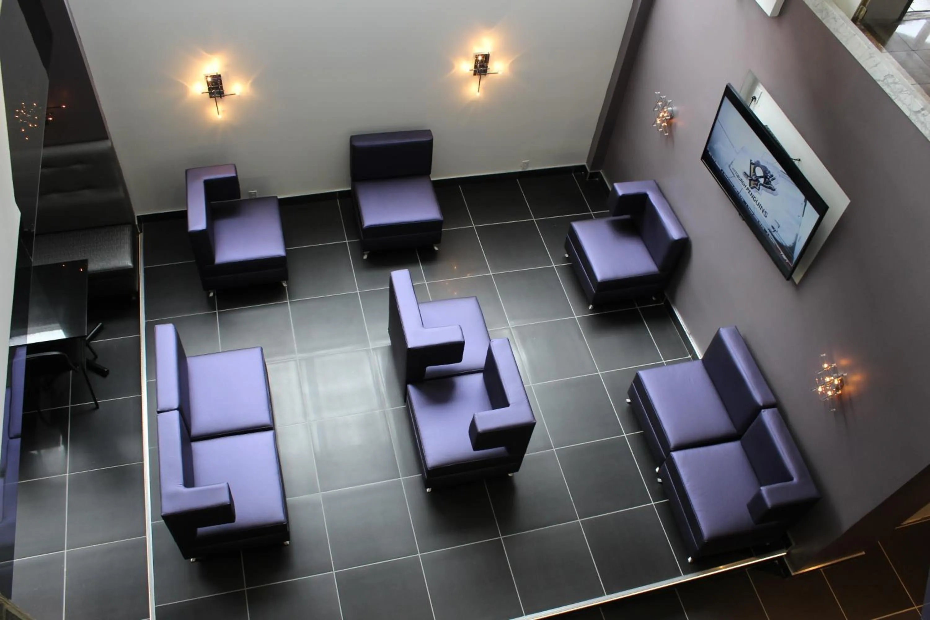 Communal lounge/ TV room in LELUX Hotel