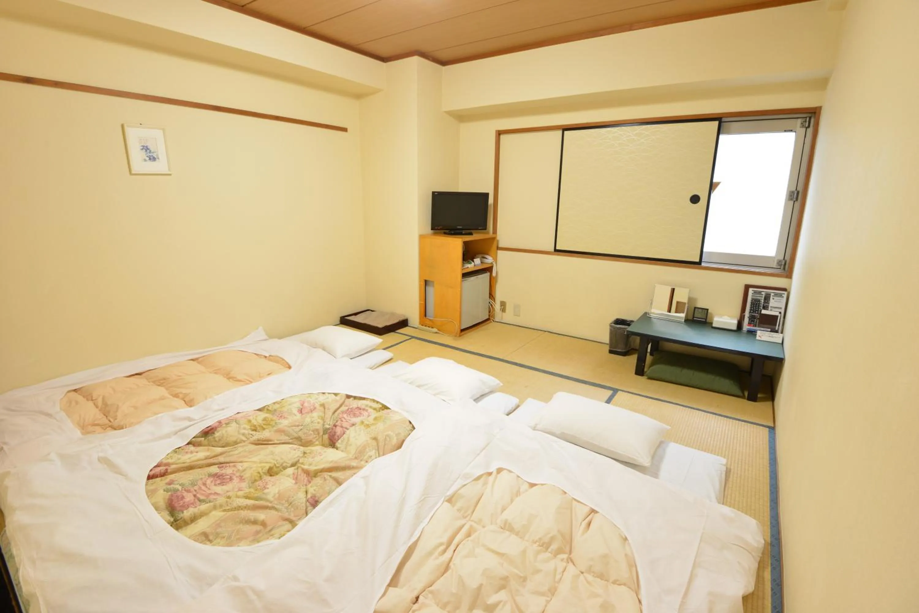 Bed in Hotel Marutani