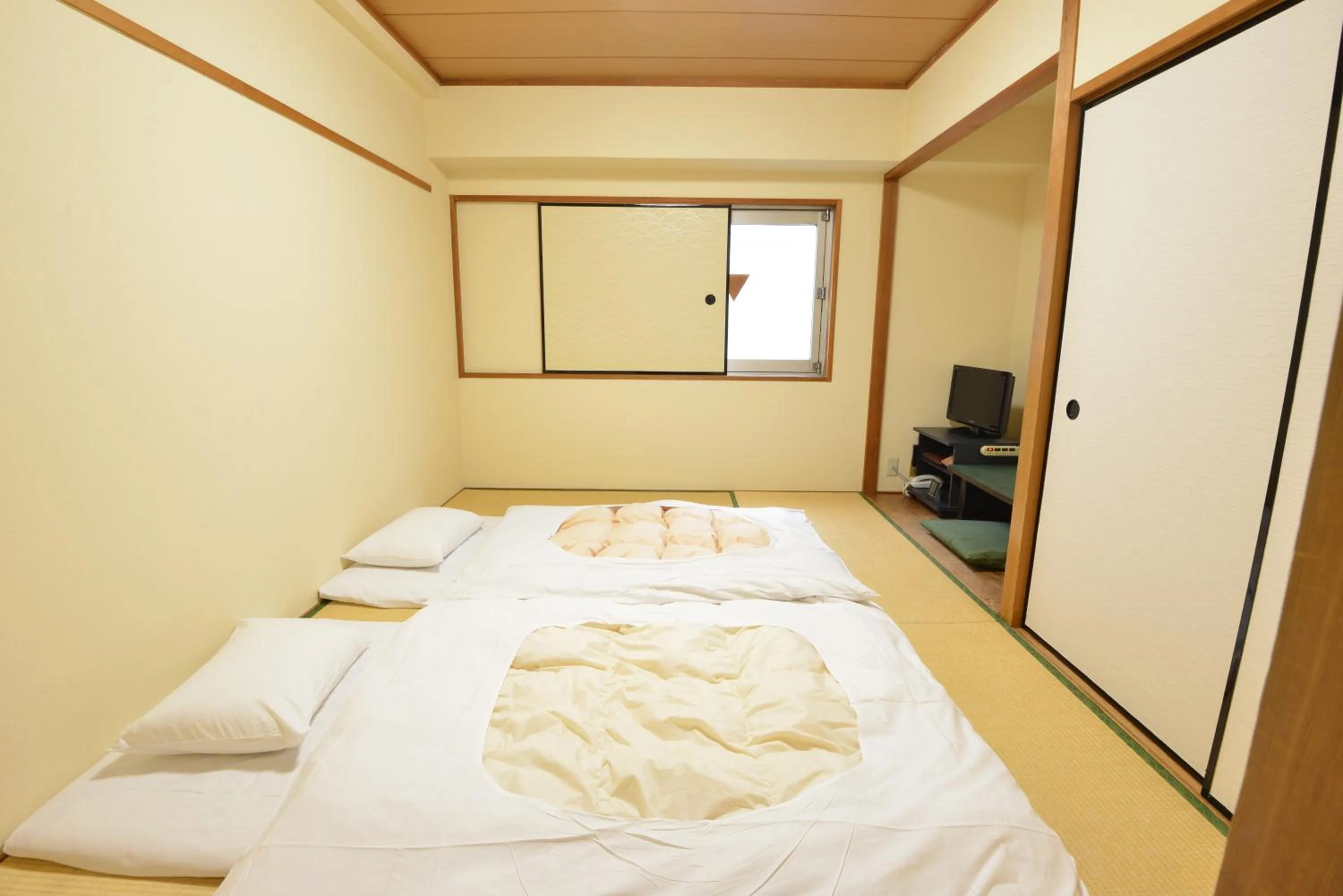 Bed in Hotel Marutani