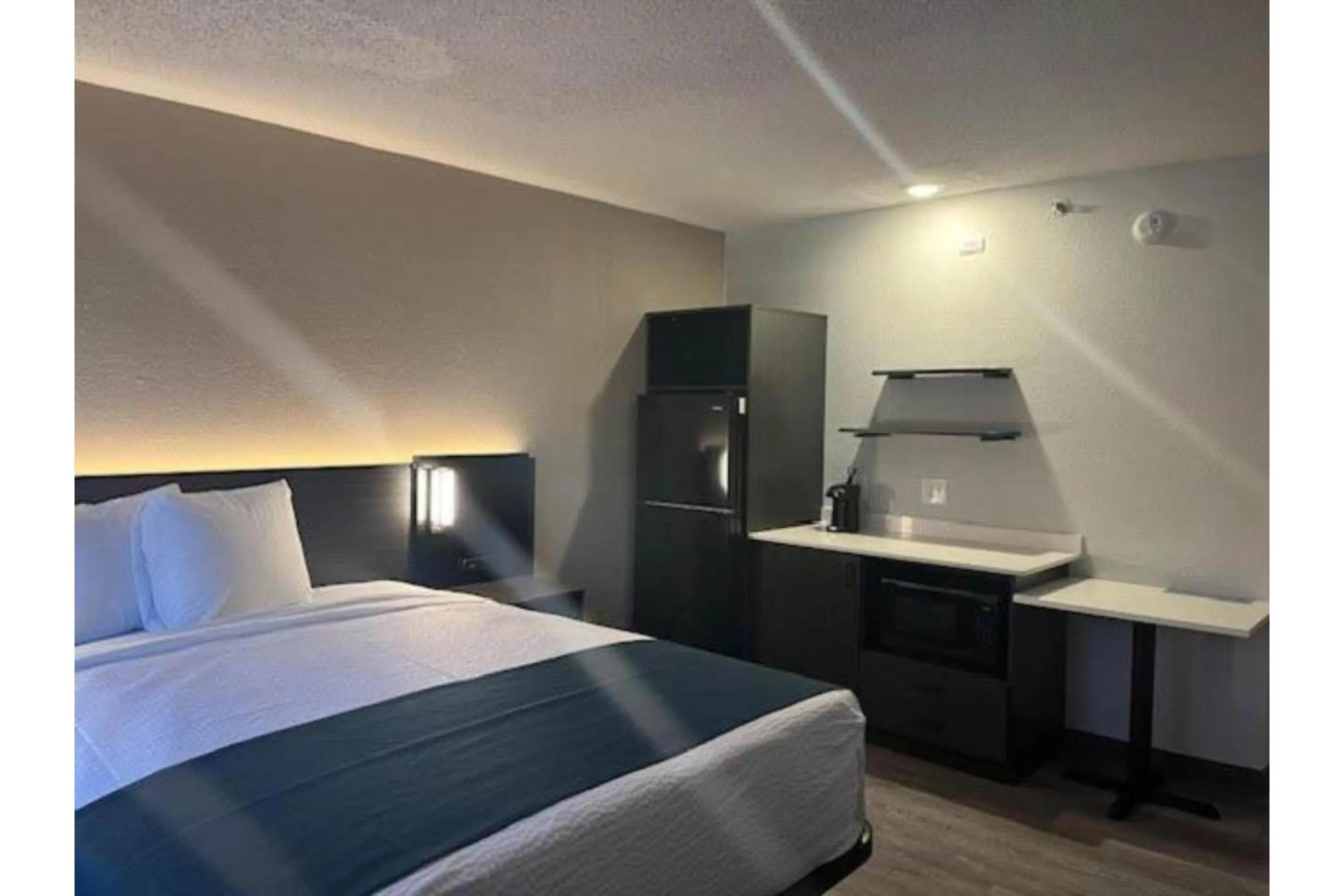 Bedroom, Bed in Studio 6 Suites Norcross, GA