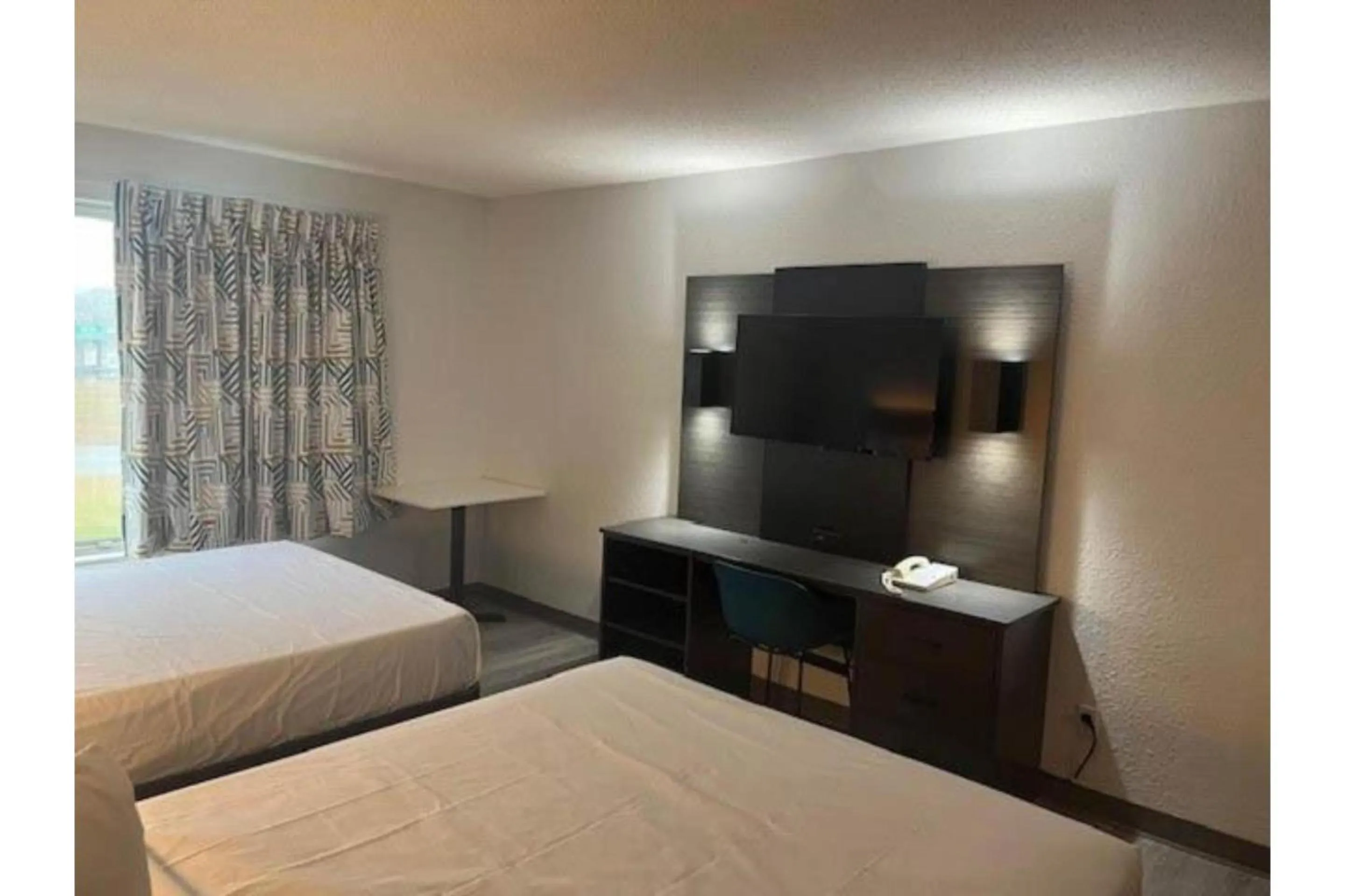 Bedroom, Bed in Studio 6 Suites Norcross, GA