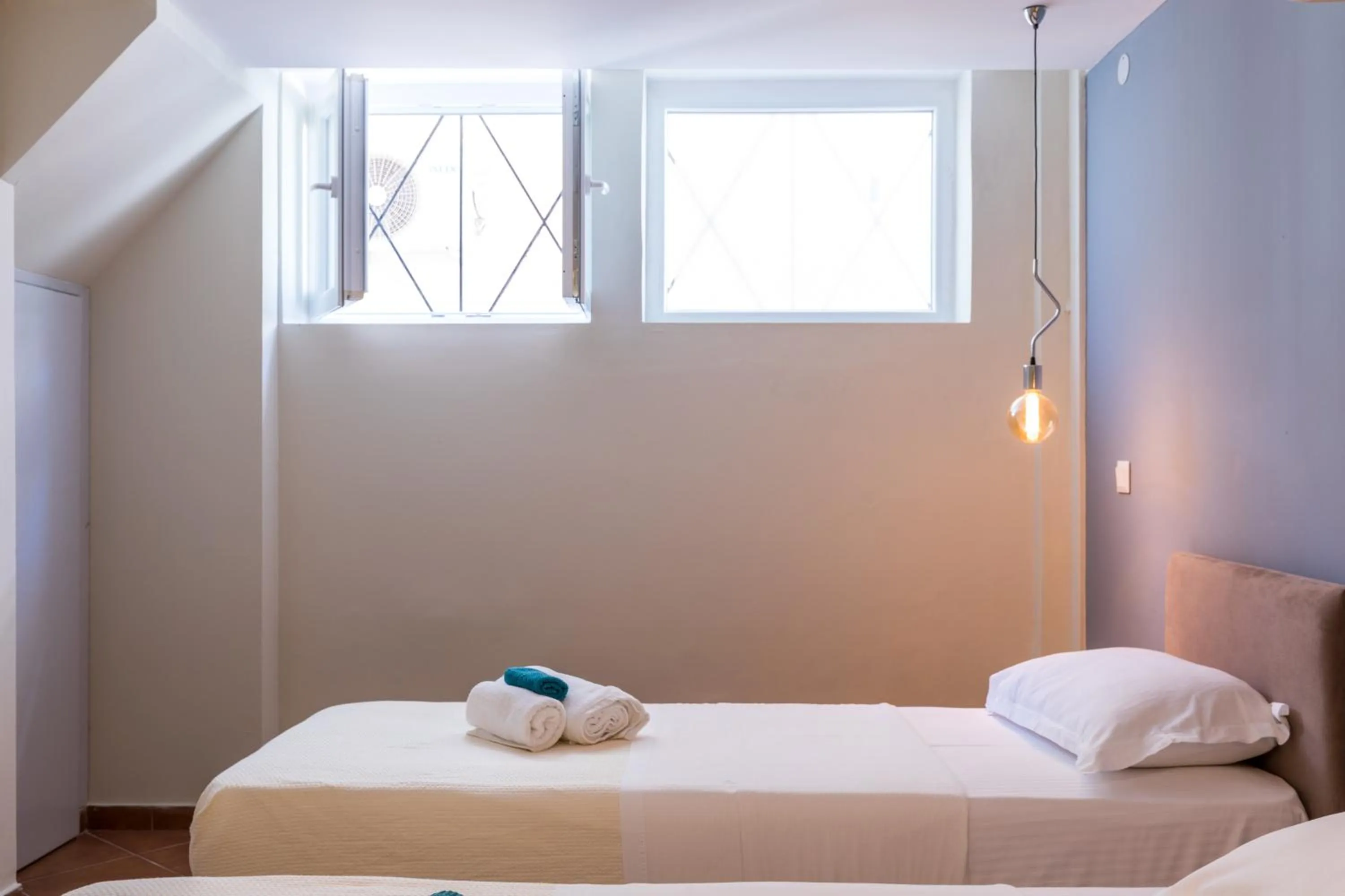 Bed in Mon-Repo Suites