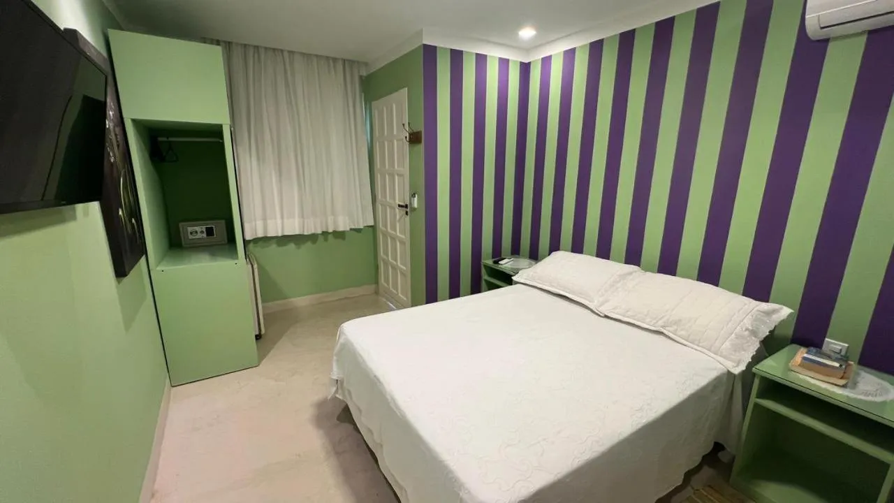 Bed in Pousada Via Brasil