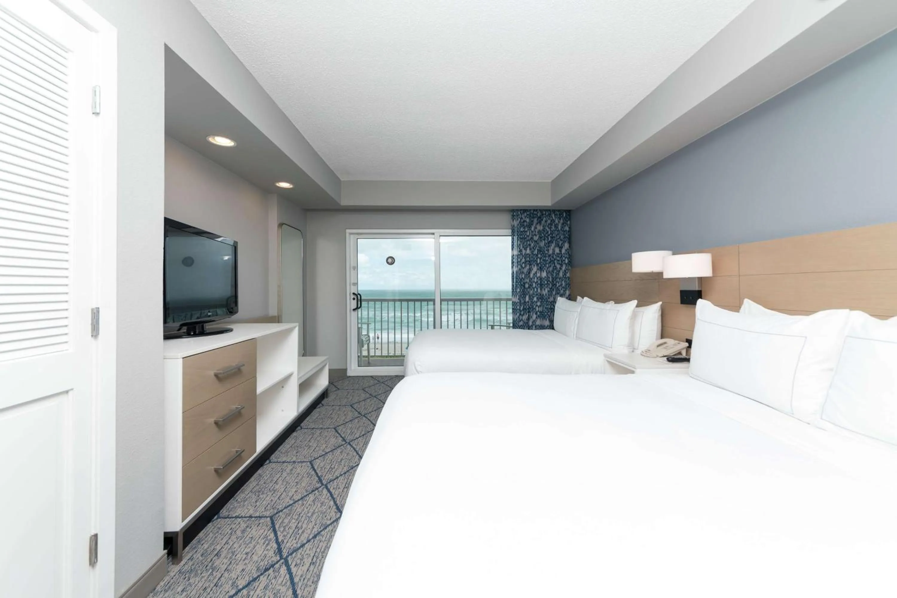 Bed in DoubleTree Suites by Hilton Melbourne Beach Oceanfront