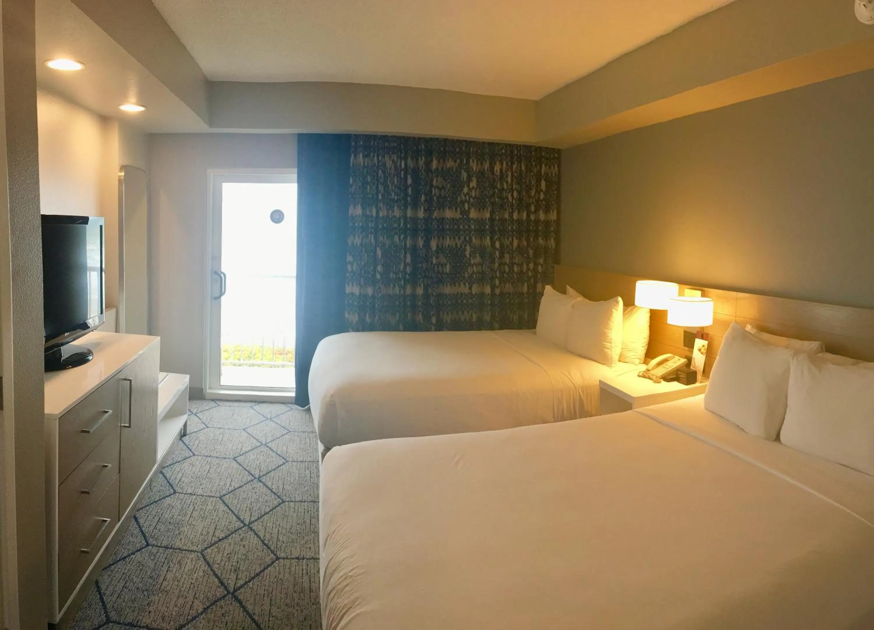 Bed in DoubleTree Suites by Hilton Melbourne Beach Oceanfront