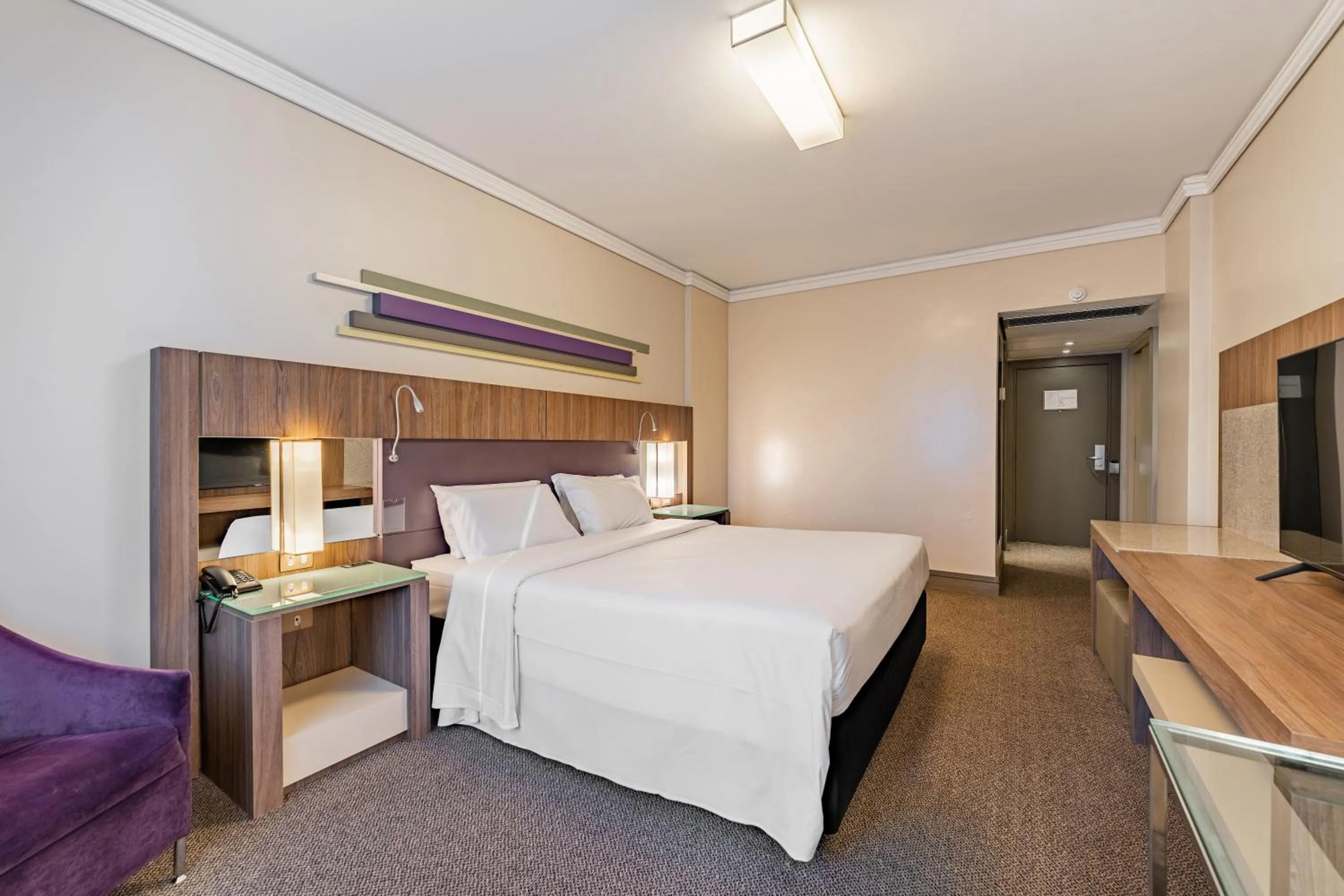 Bed in Grand Mercure Curitiba Rayon