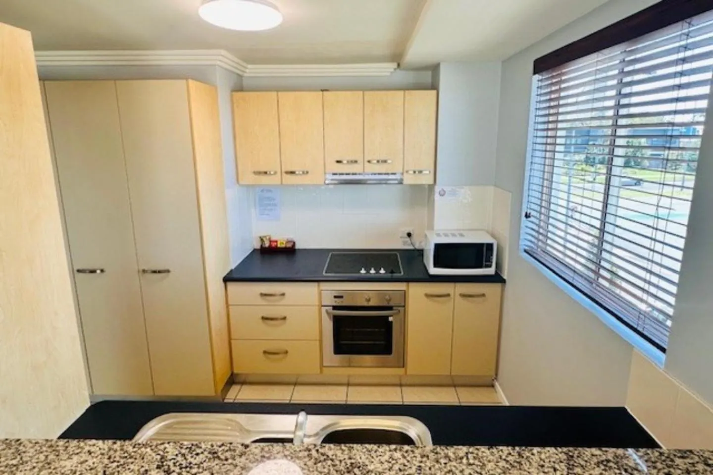 kitchen in Caloundra Central Apartment Hotel Official