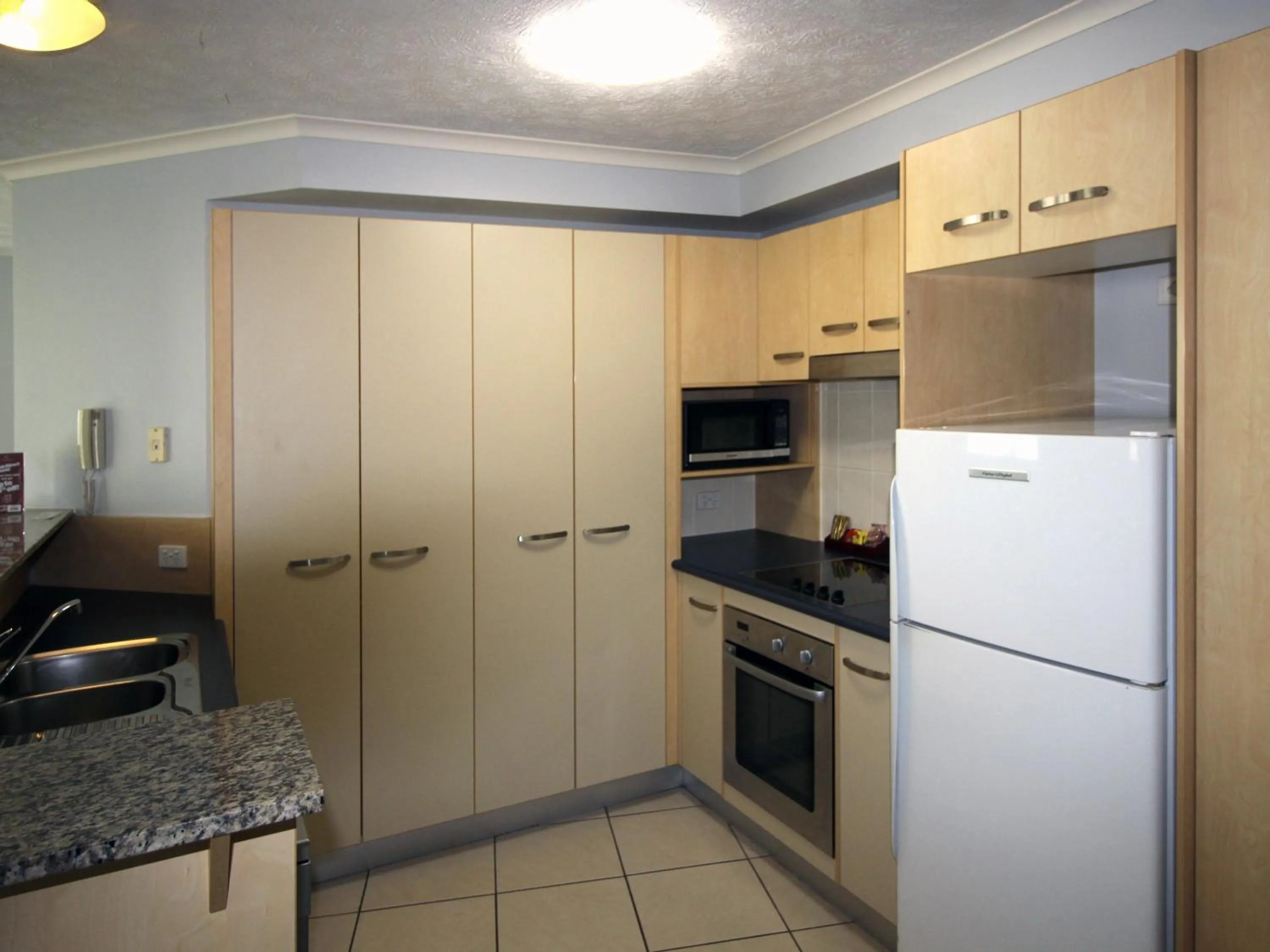 kitchen in Caloundra Central Apartment Hotel Official