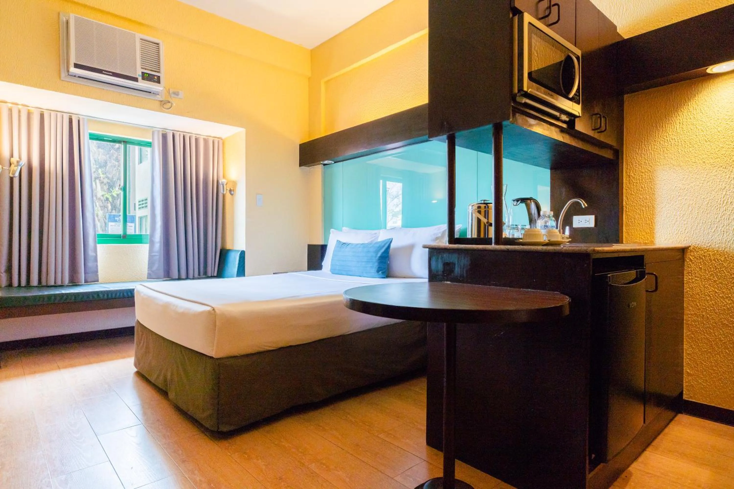 Bed in Microtel by Wyndham Cabanatuan