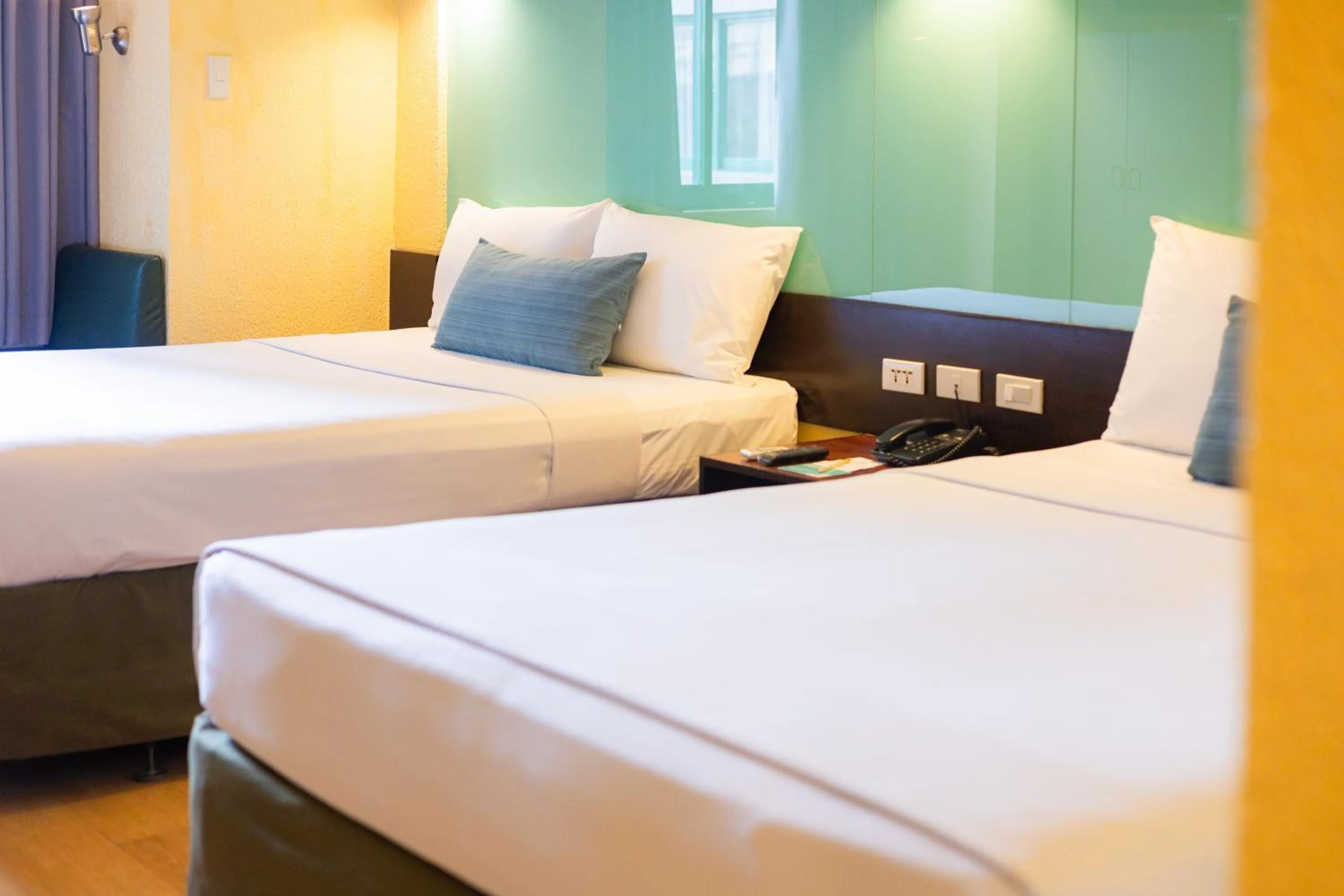 Bed in Microtel by Wyndham Cabanatuan