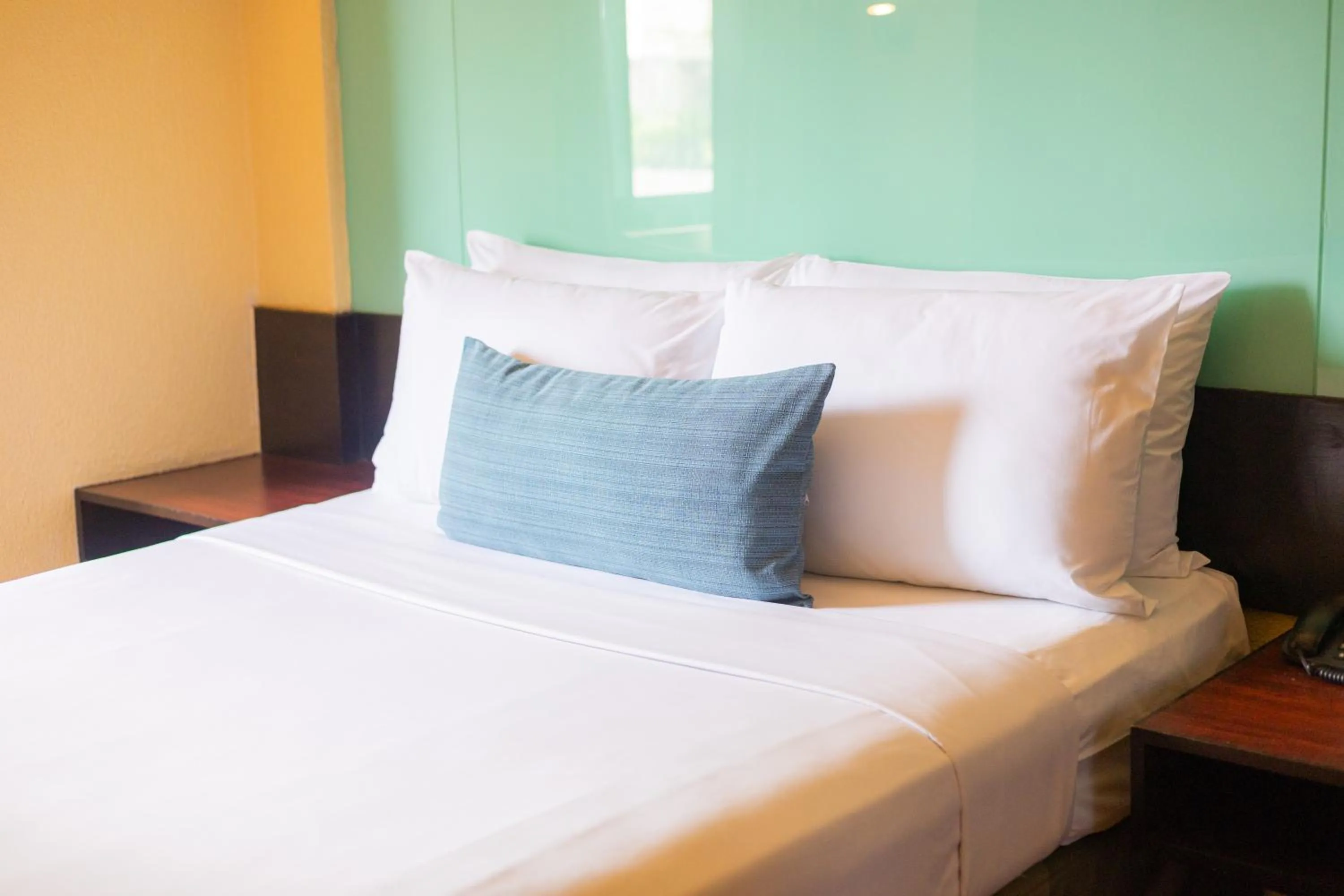 Bed in Microtel by Wyndham Cabanatuan