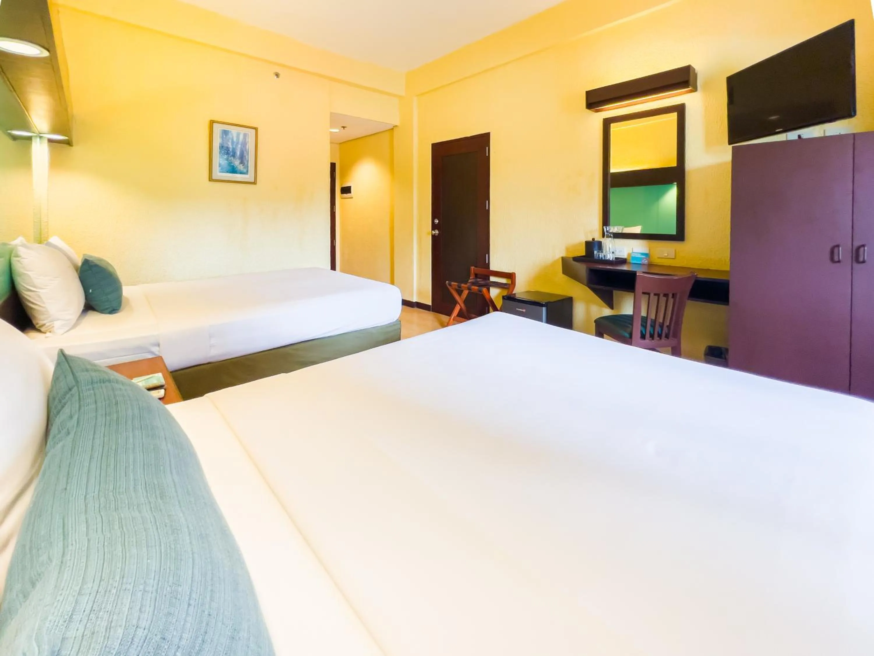 Bed in Microtel by Wyndham Cabanatuan