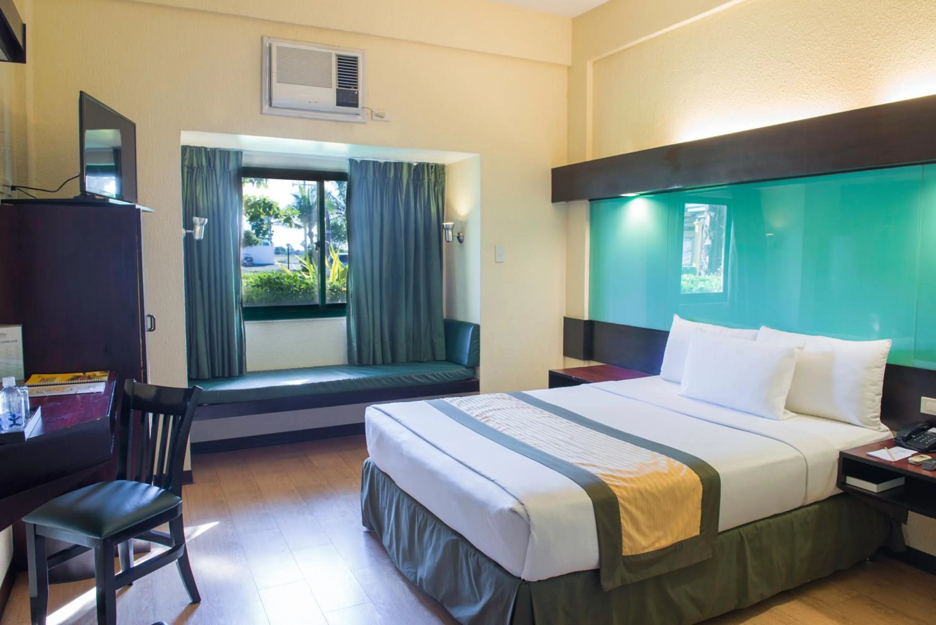 Bed in Microtel by Wyndham Cabanatuan