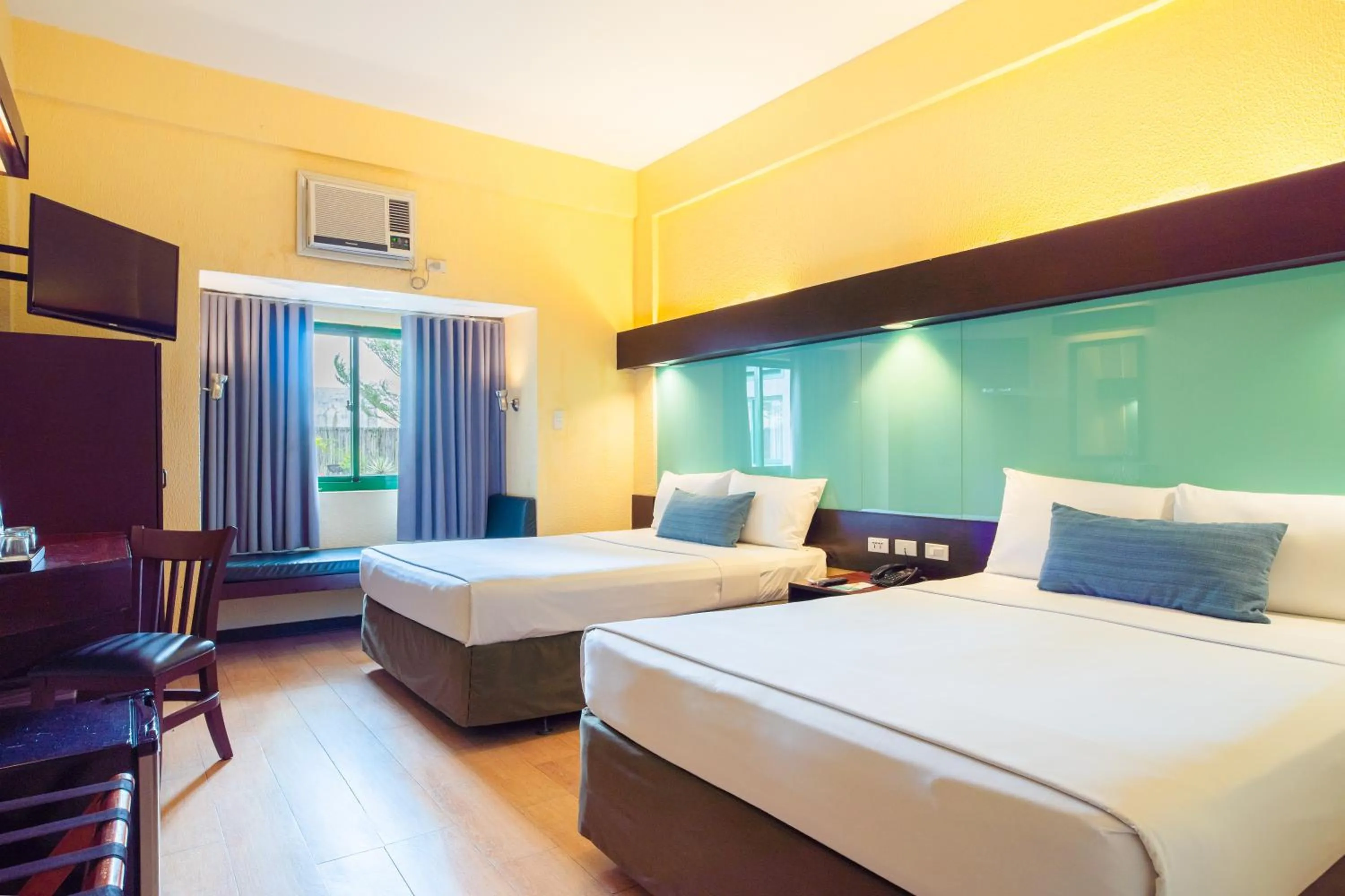 Bed in Microtel by Wyndham Cabanatuan