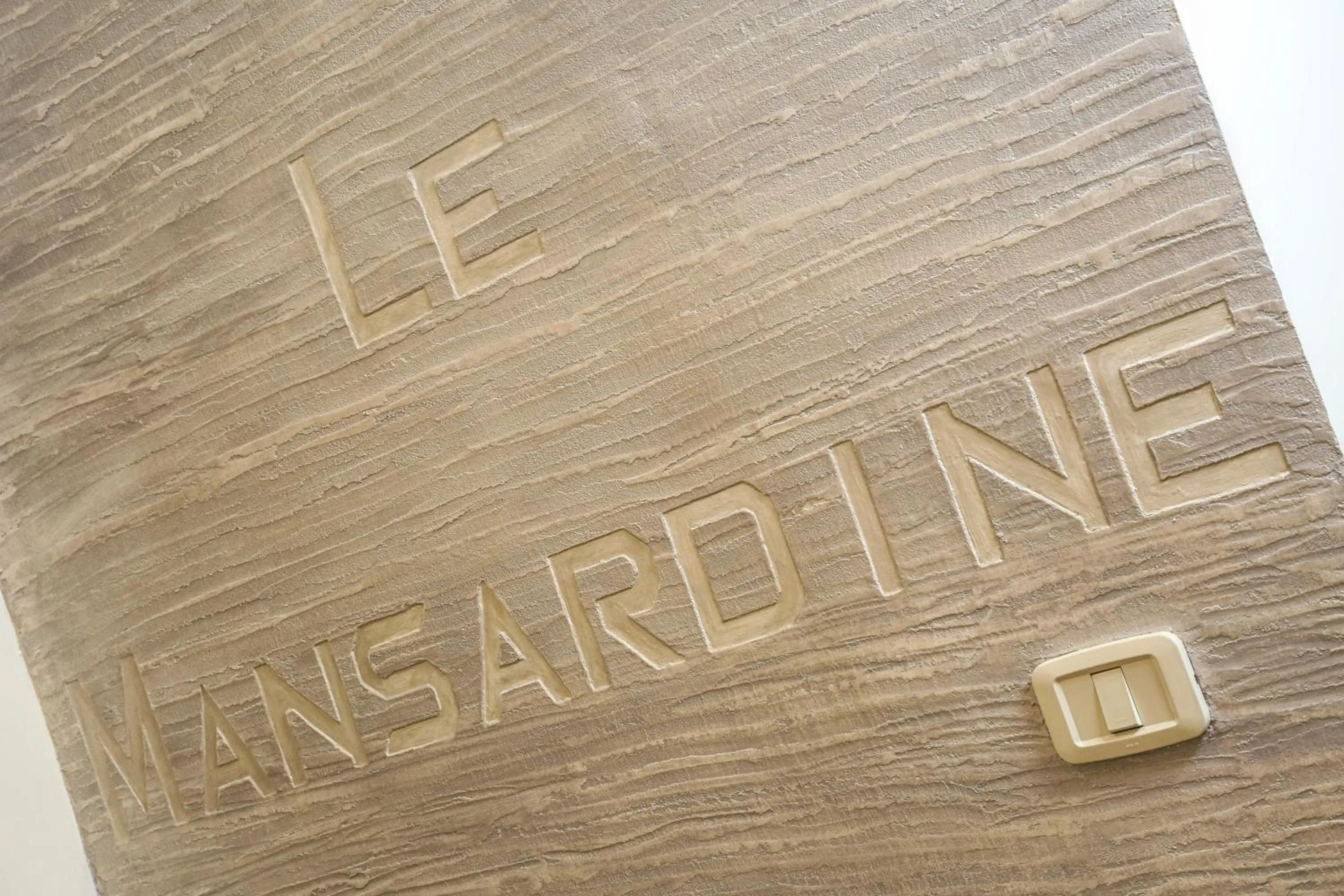 Property logo or sign in Le mansardine