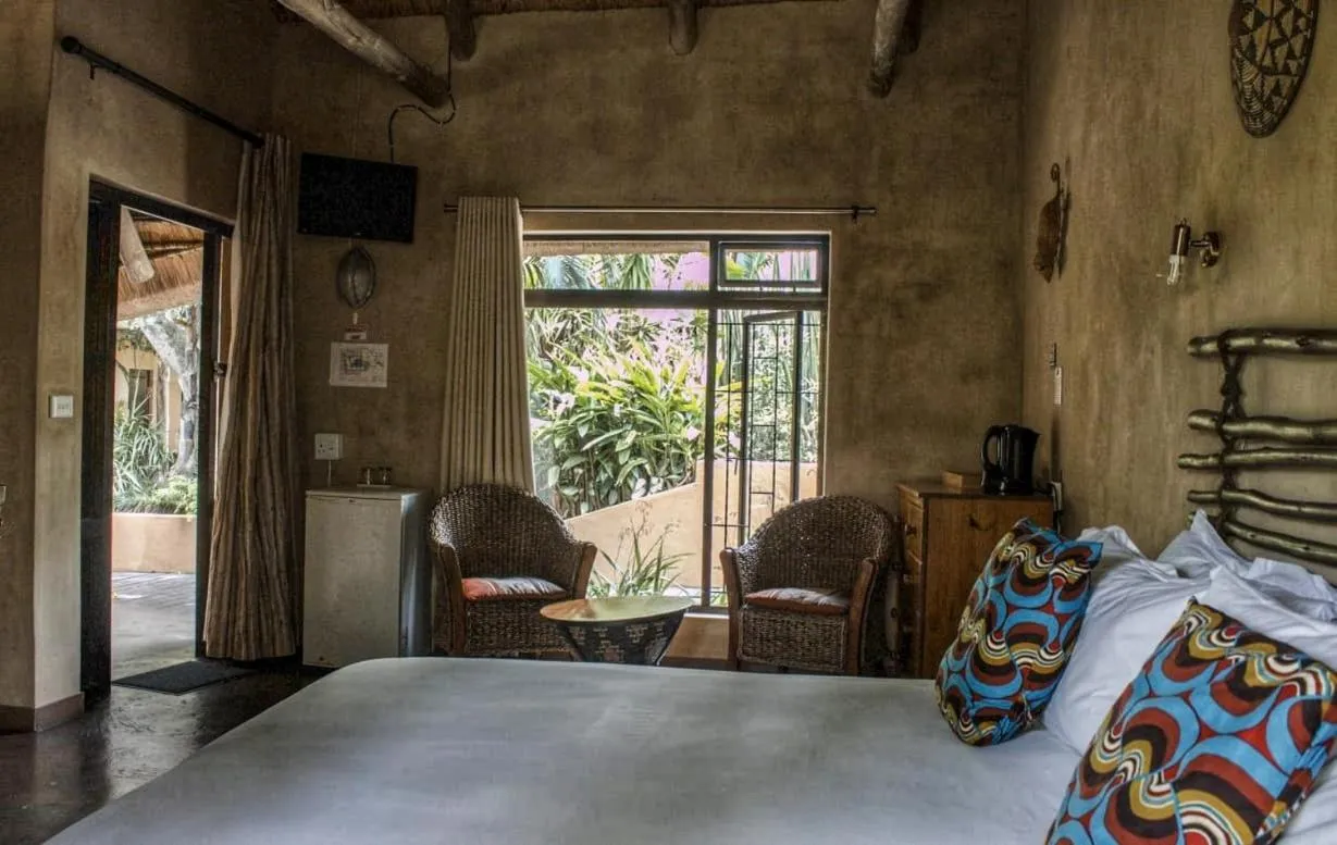 Photo of the whole room, Bed in AmaZulu Lodge
