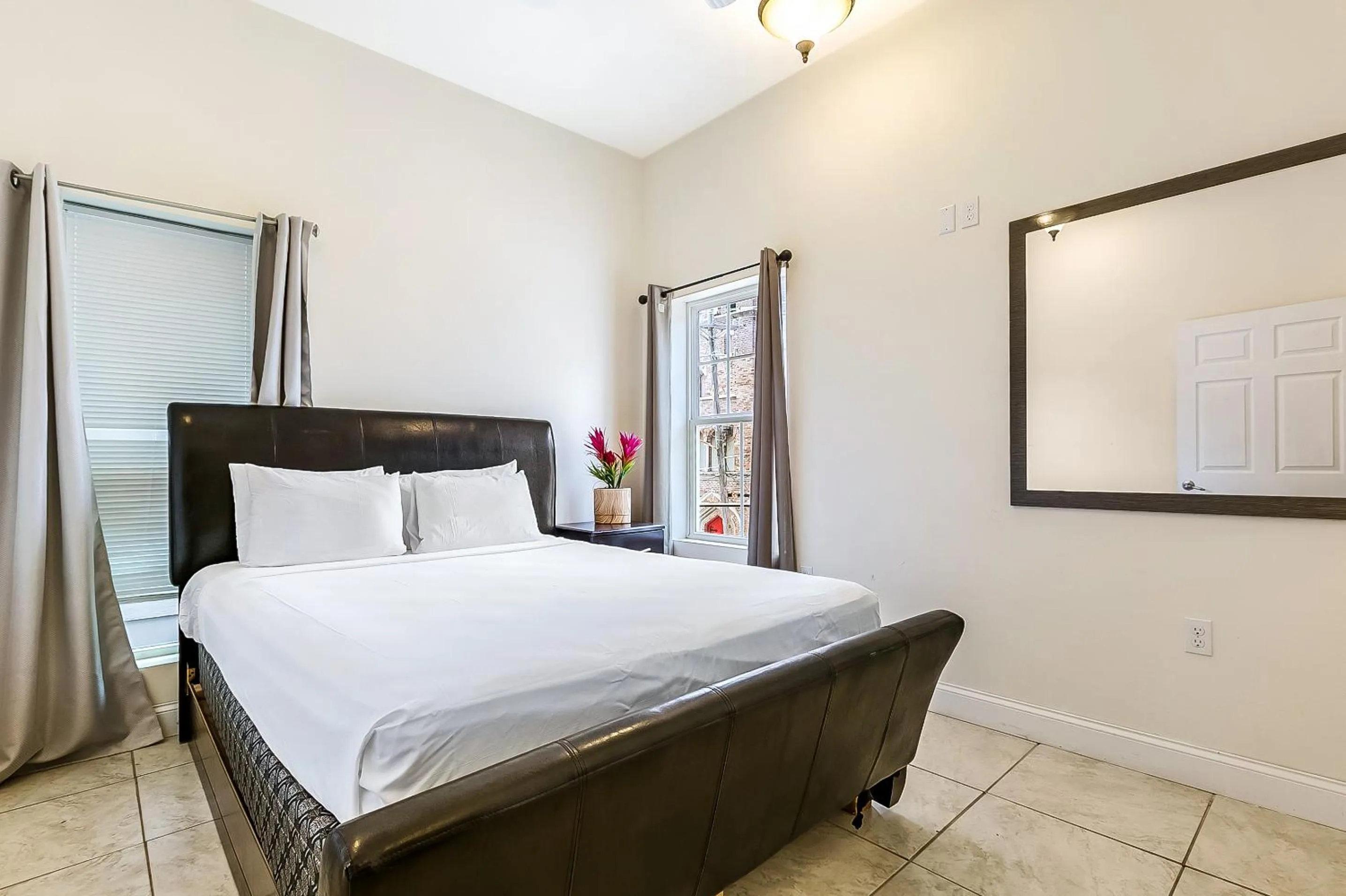 Bedroom, Bed in Urban Condos with Spacious Rooms & Amenities