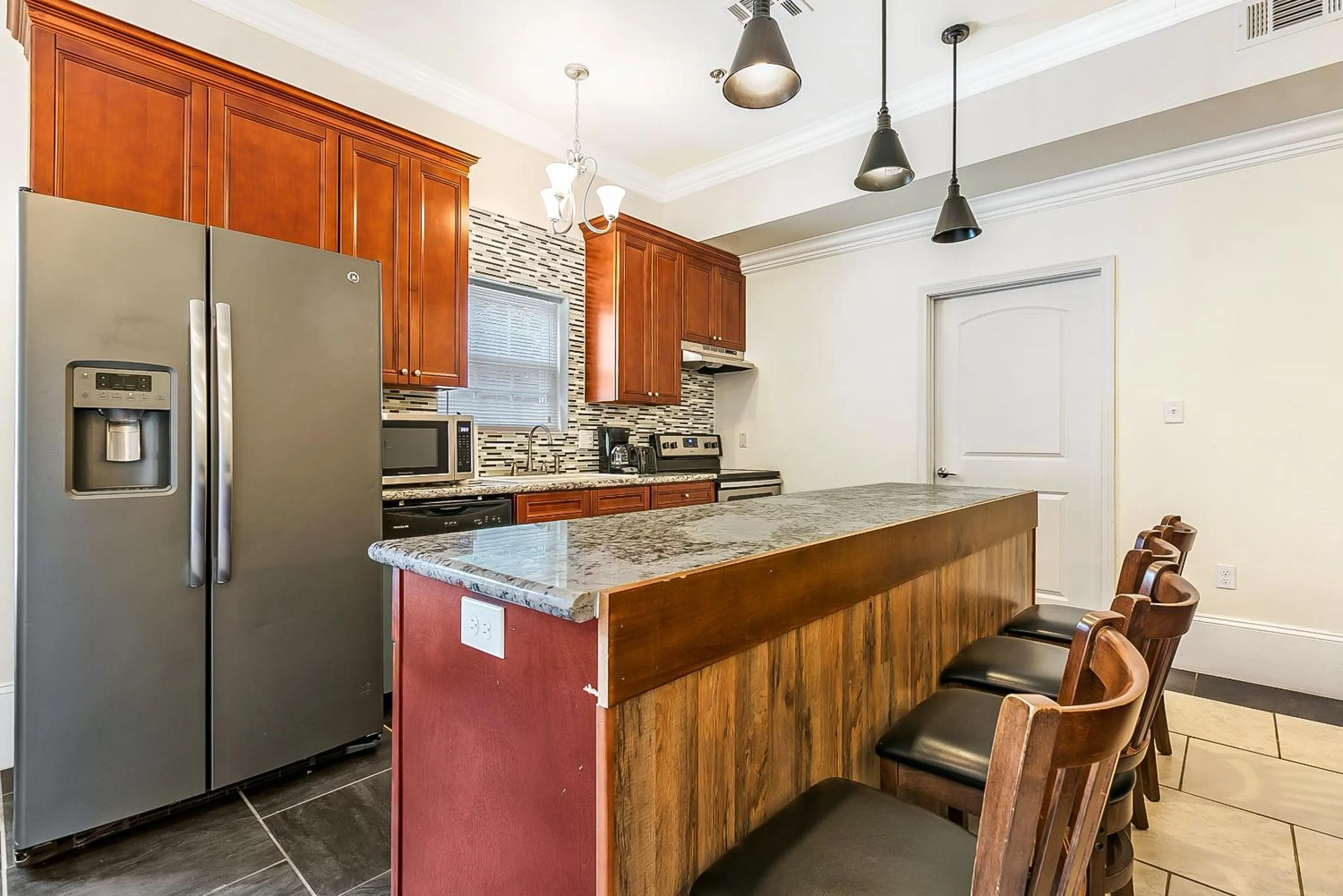 Kitchen or kitchenette in Urban Condos with Spacious Rooms & Amenities