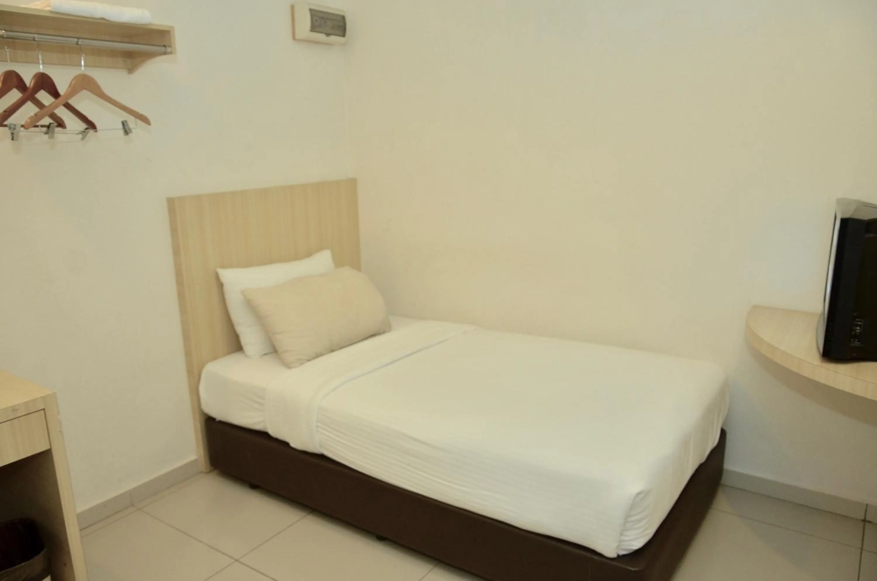 Bed in Swan Garden Hotel