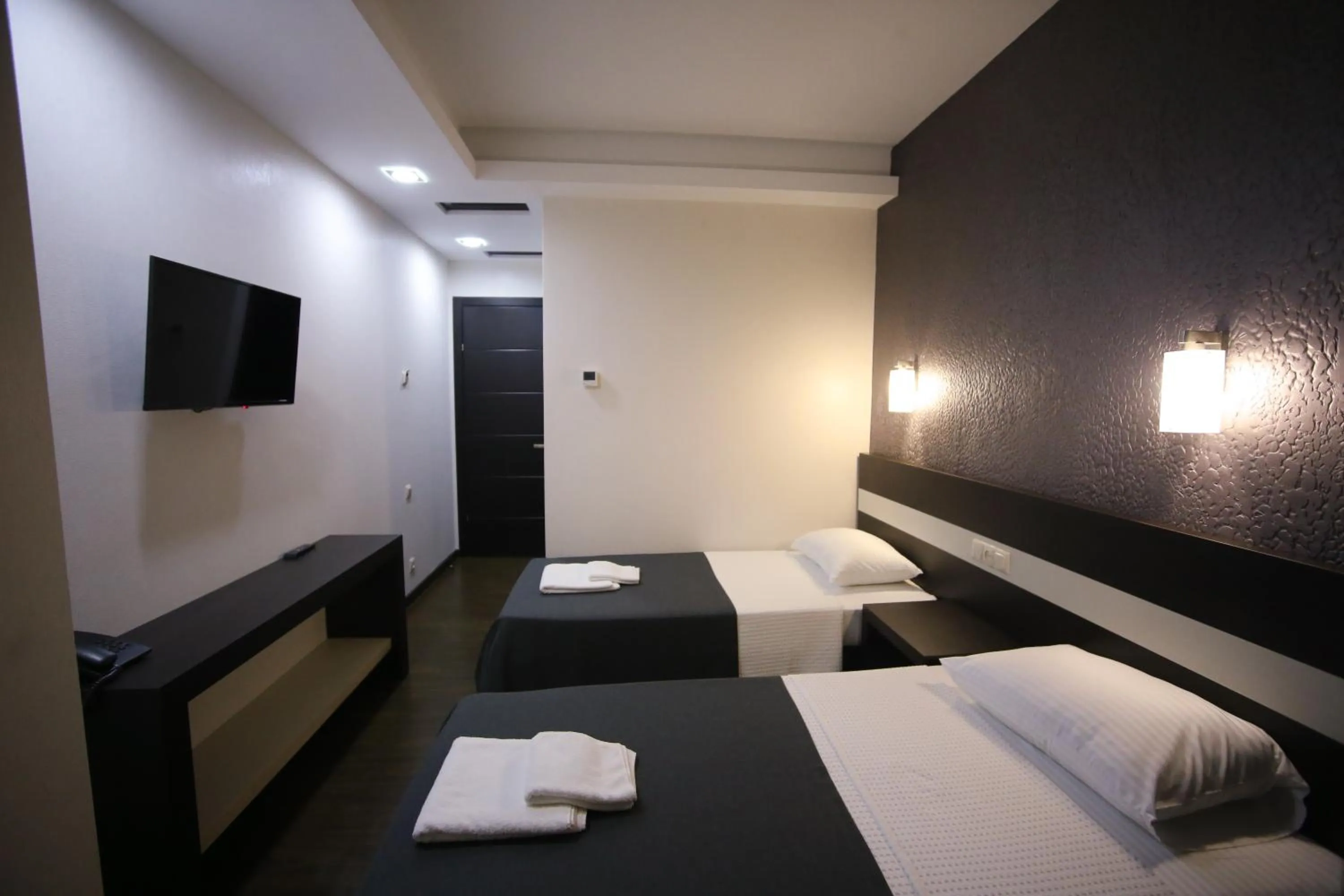 Bed in West Tower Hotel