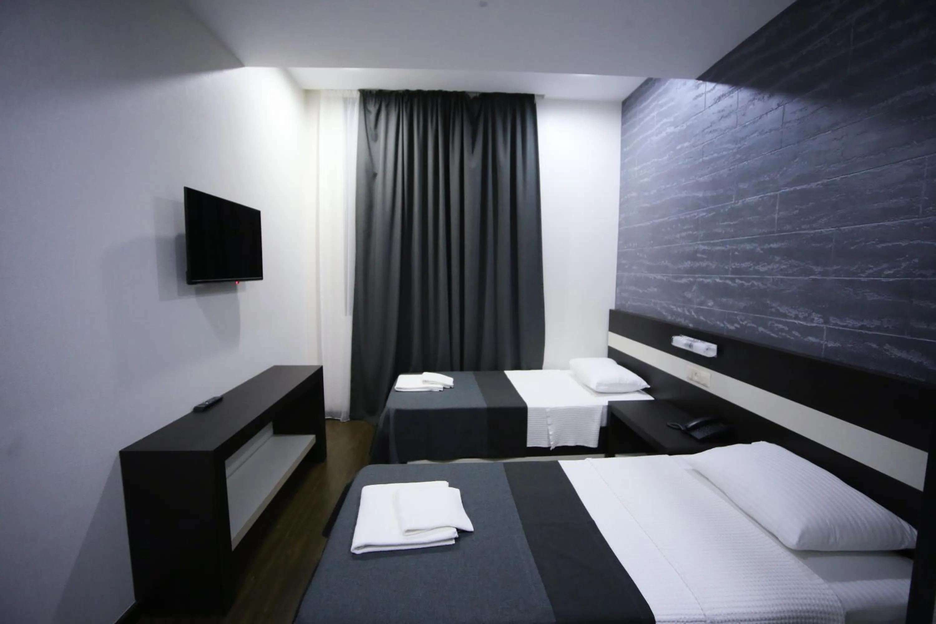 Bed in West Tower Hotel