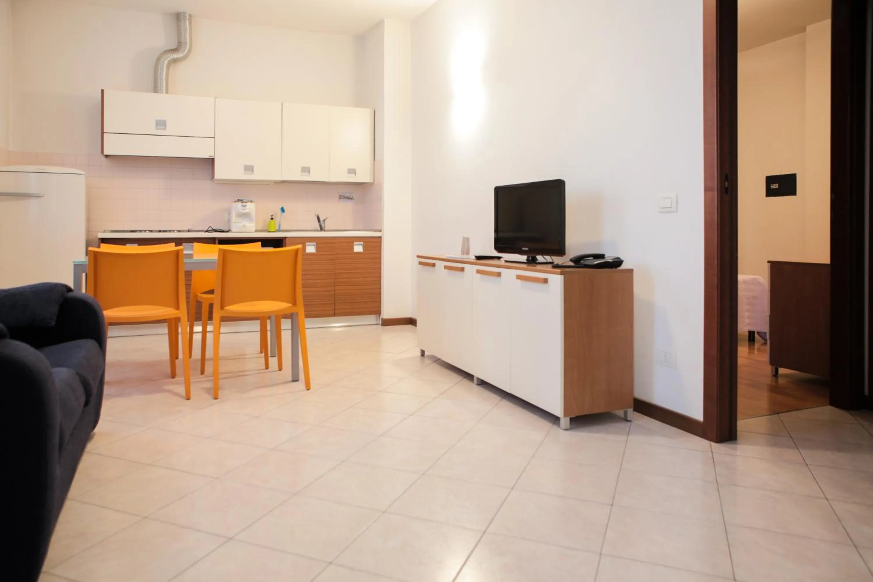 Kitchen or kitchenette in Verona Class ApartHotel "Residenze del Cuore"