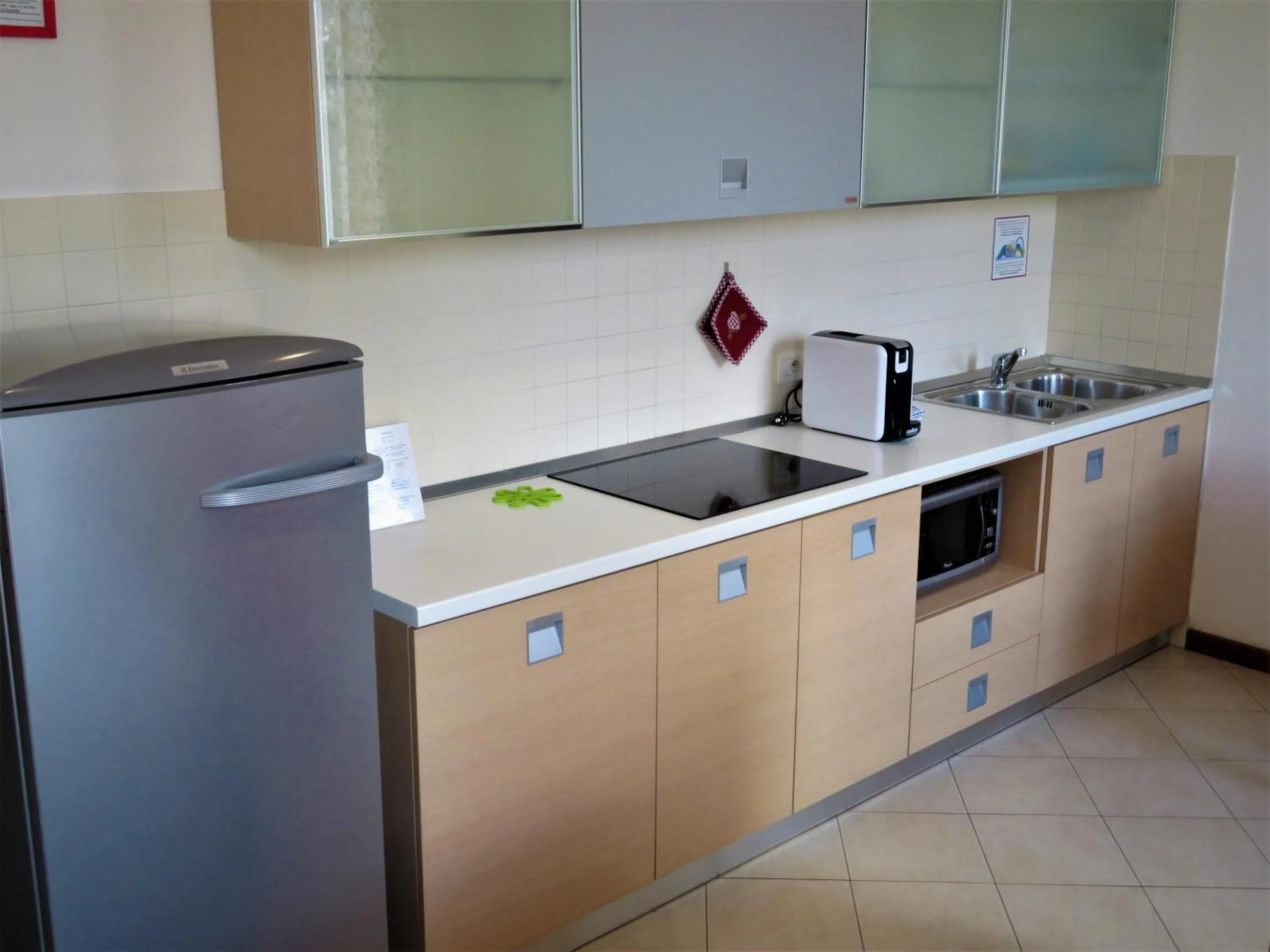 Kitchen or kitchenette in Verona Class ApartHotel "Residenze del Cuore"