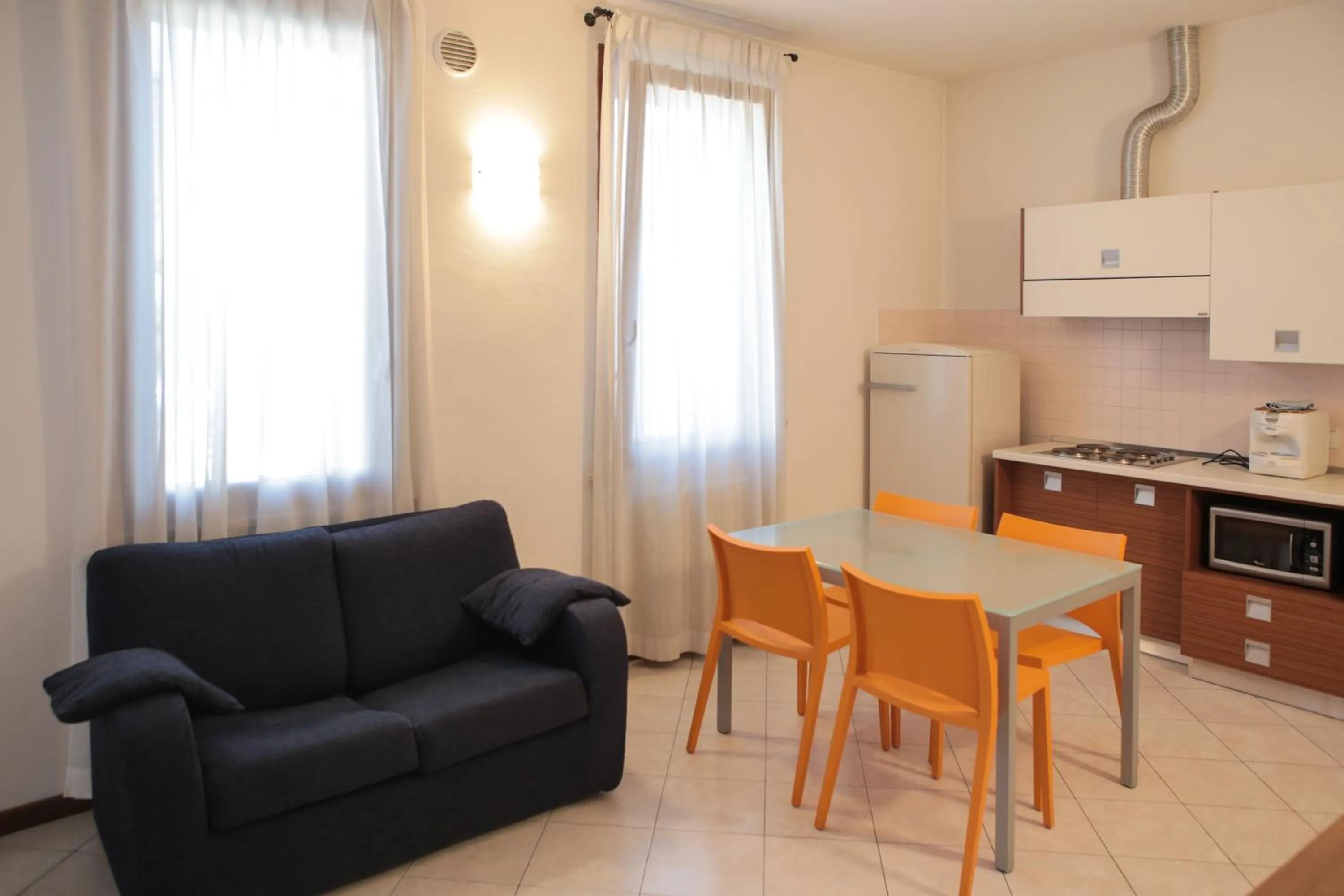 Kitchen or kitchenette in Verona Class ApartHotel "Residenze del Cuore"