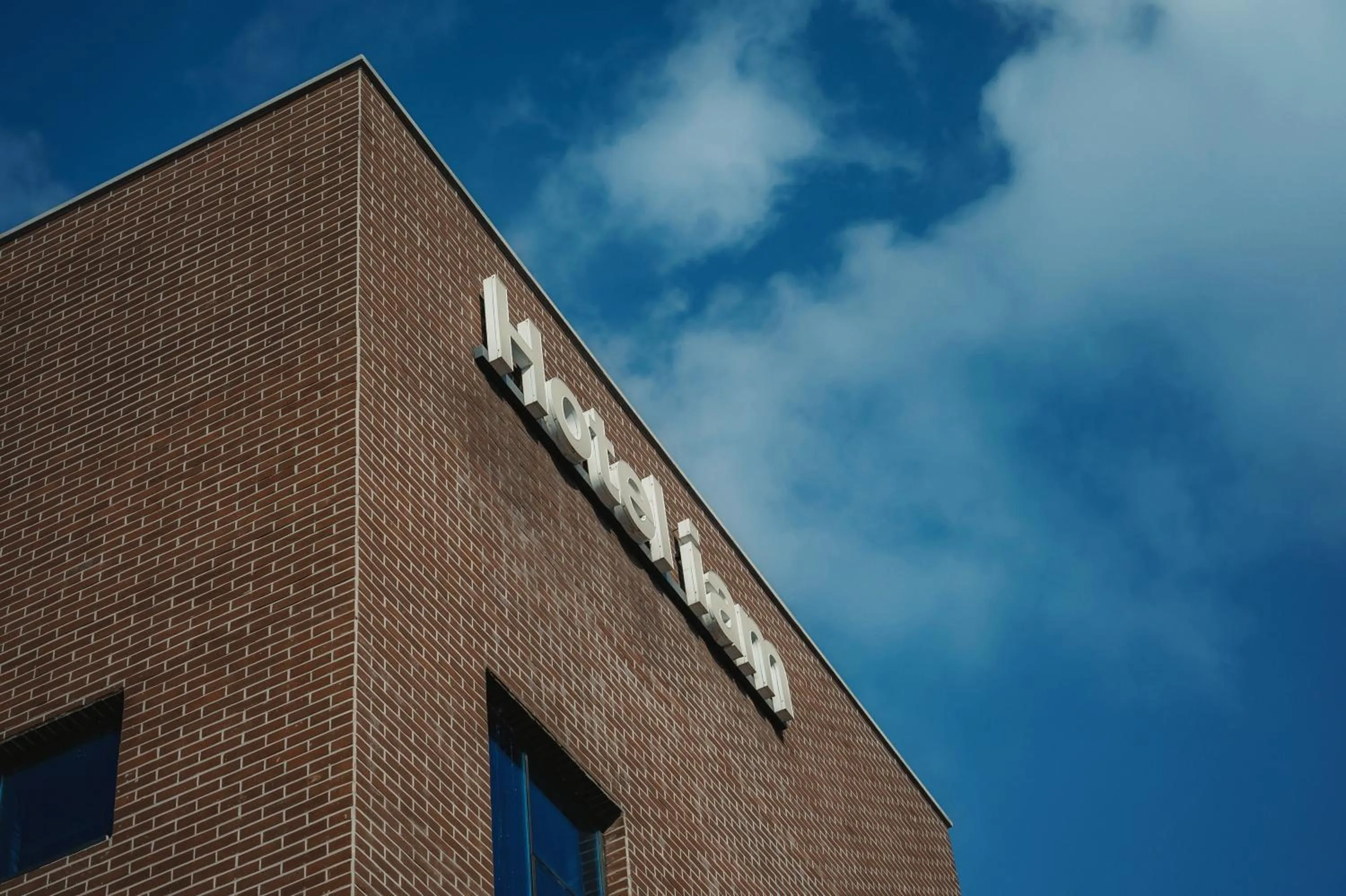 Property logo or sign in Hotel Iam