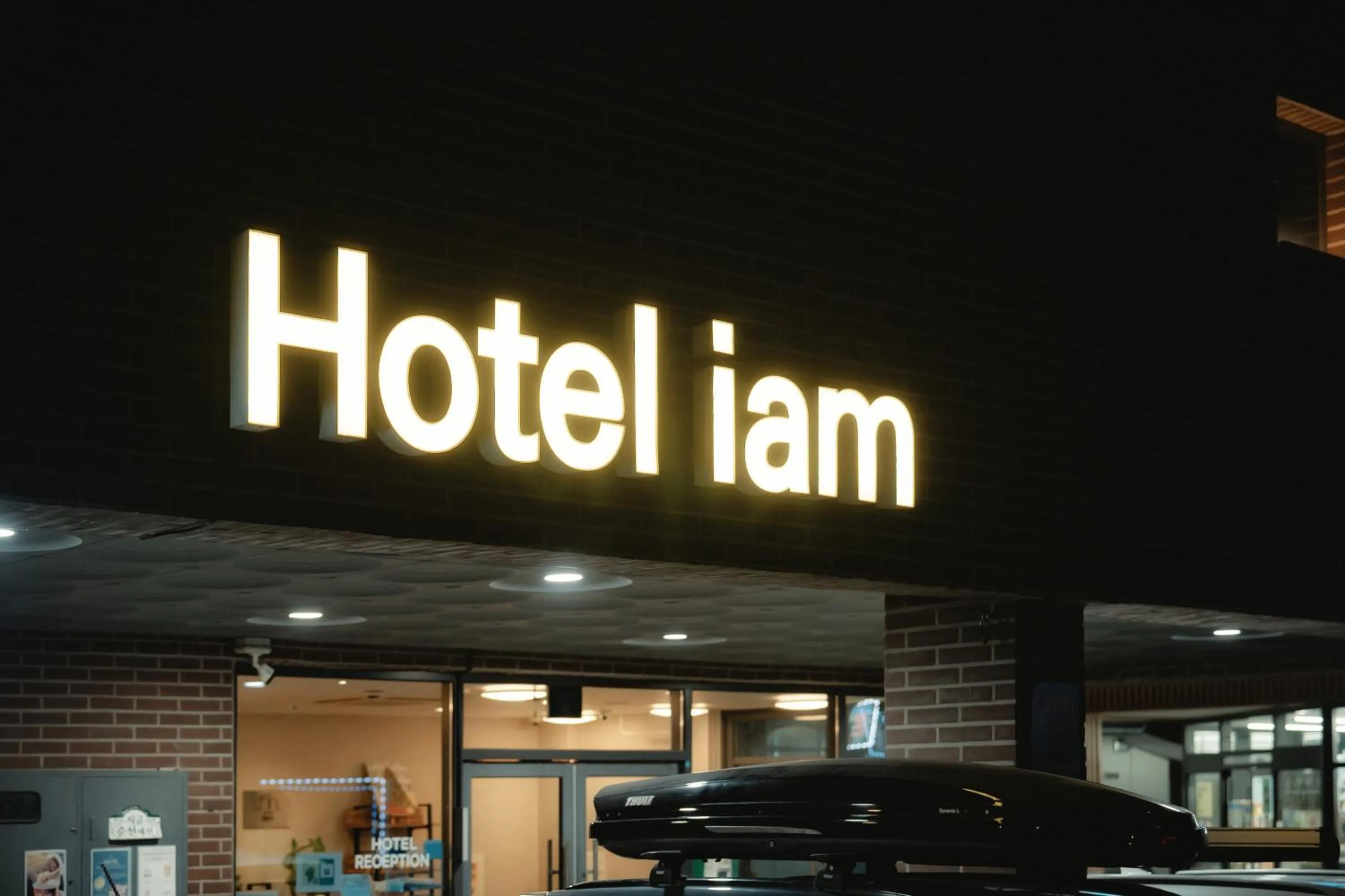 Property logo or sign in Hotel Iam