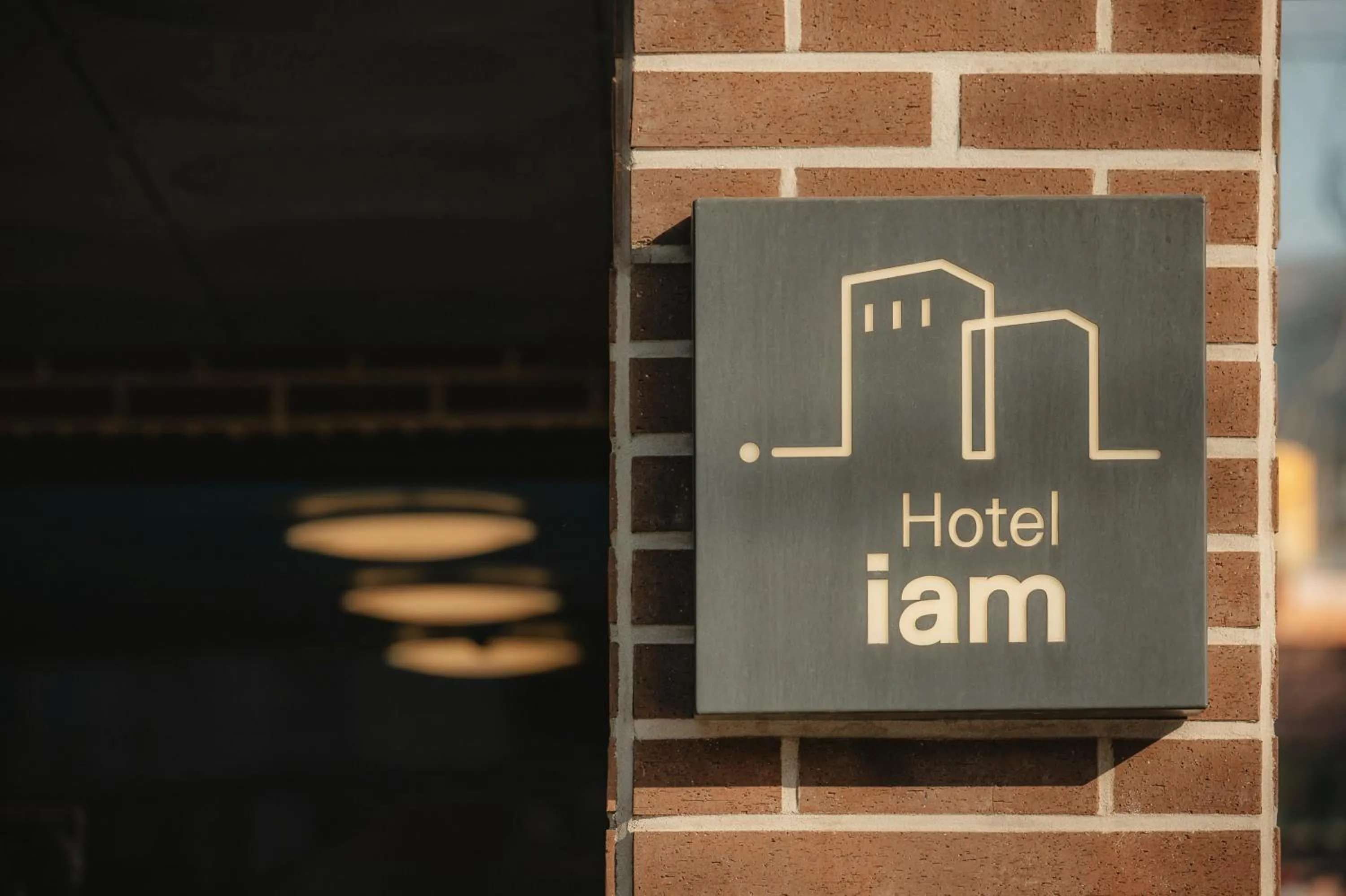 Property logo or sign in Hotel Iam