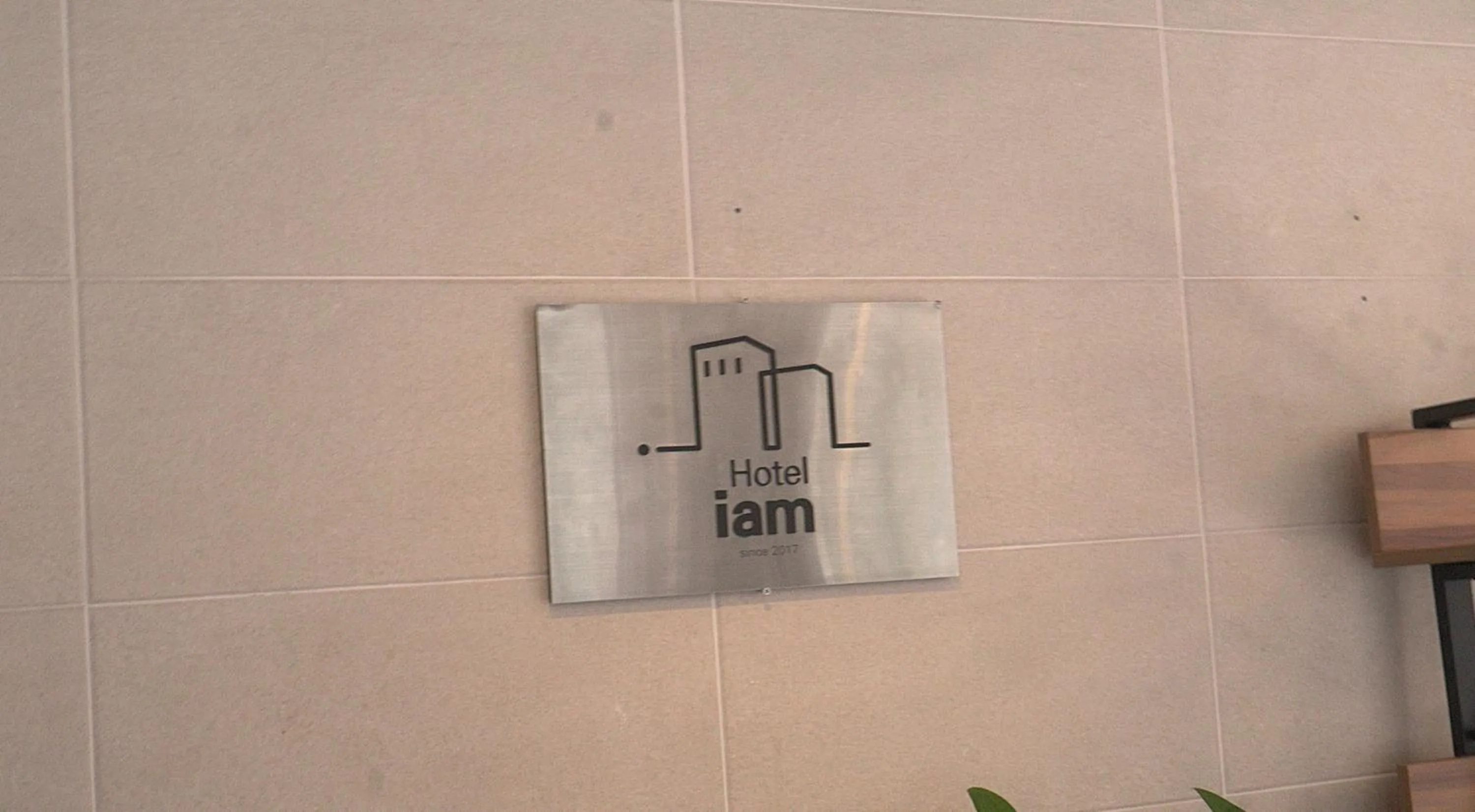 Property logo or sign in Hotel Iam